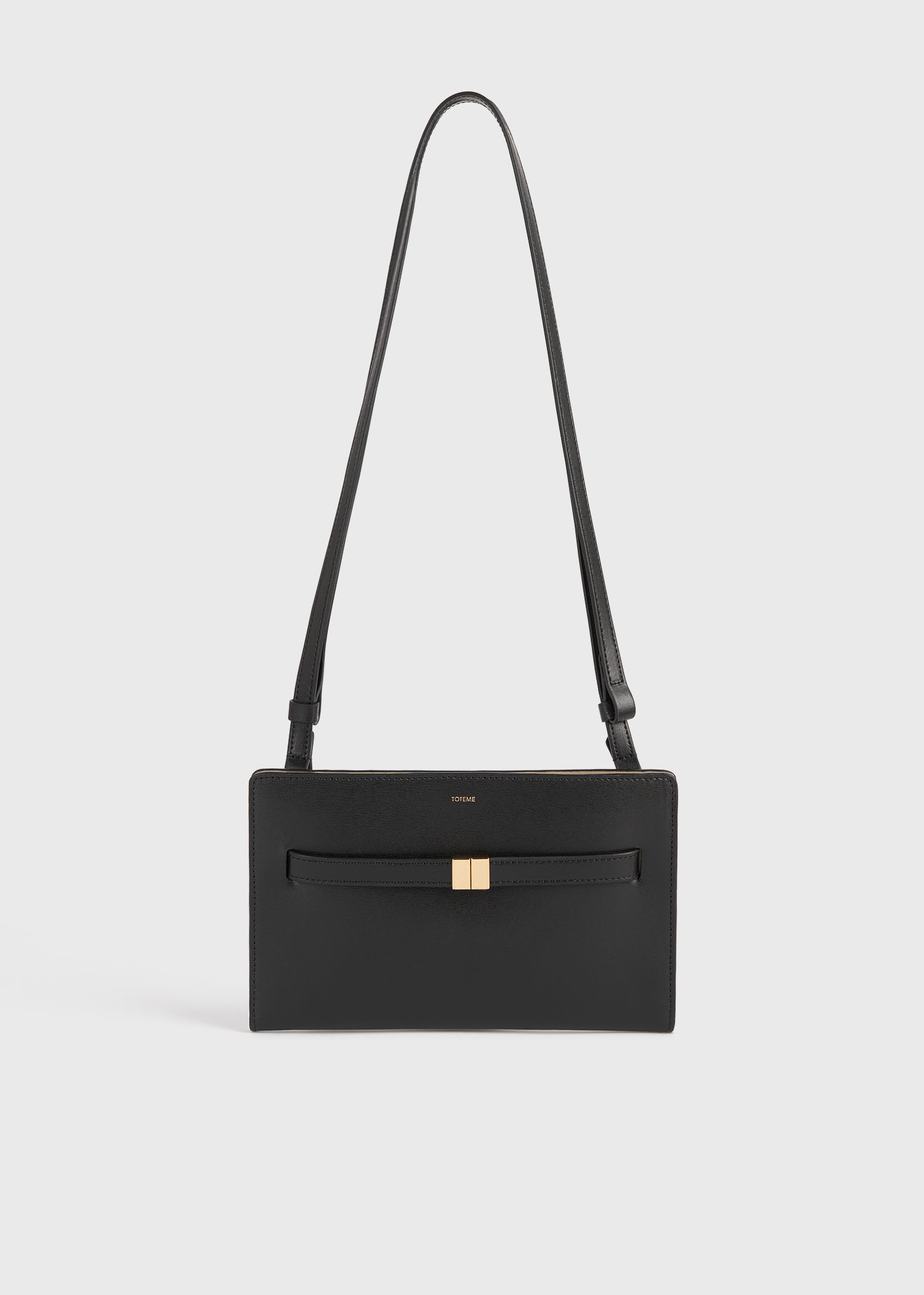 Belted leather crossbody black – TOTEME