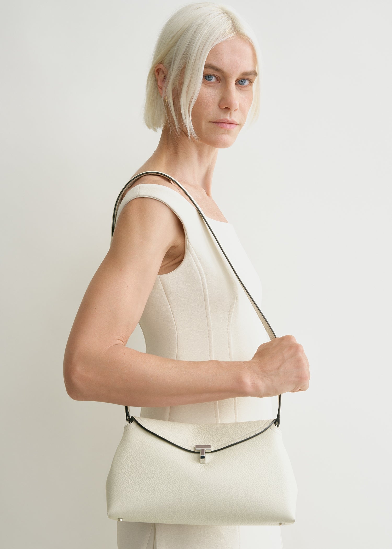 T-Lock grained-leather clutch milk – TOTEME