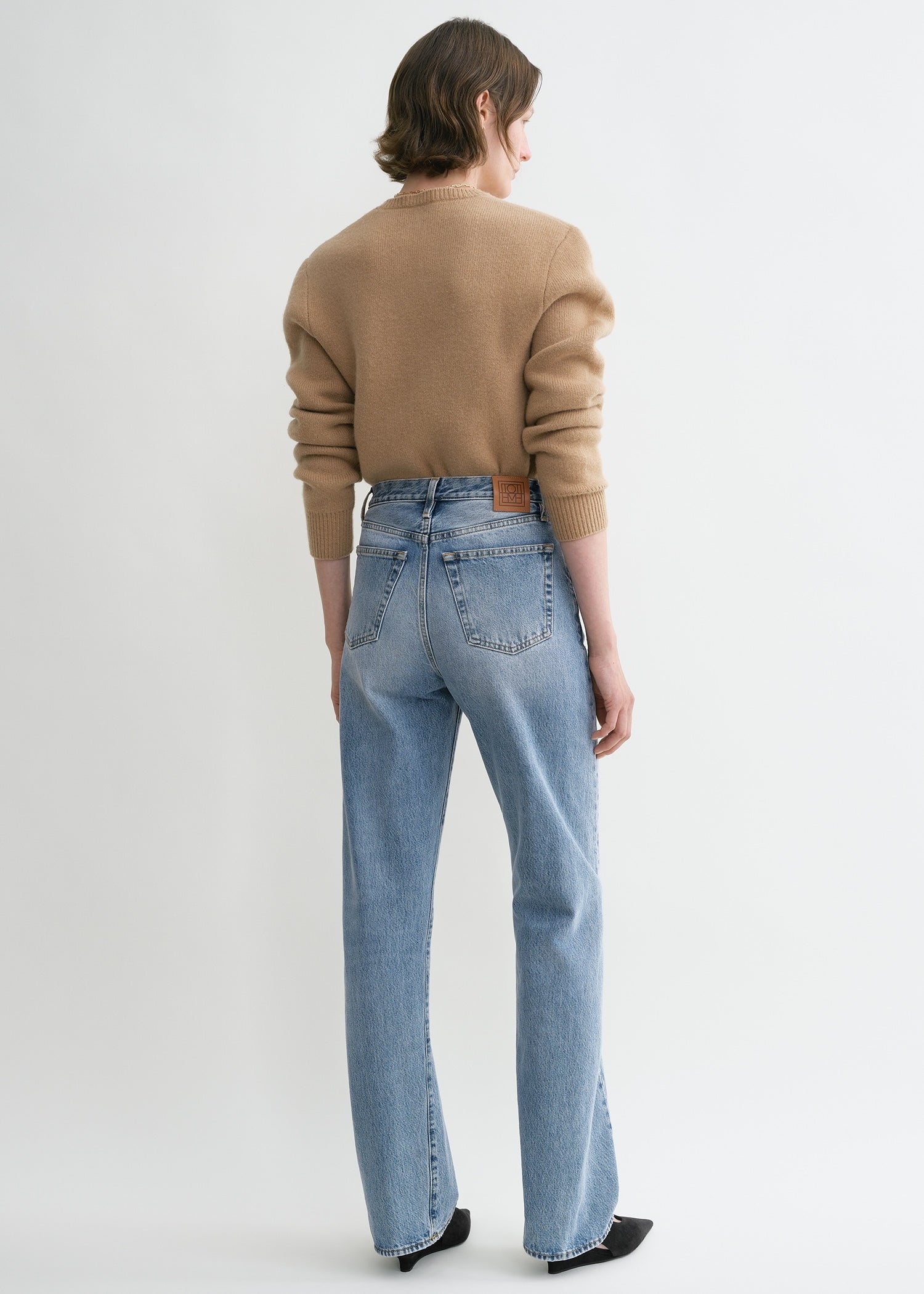 Twisted seam denim full length worn blue