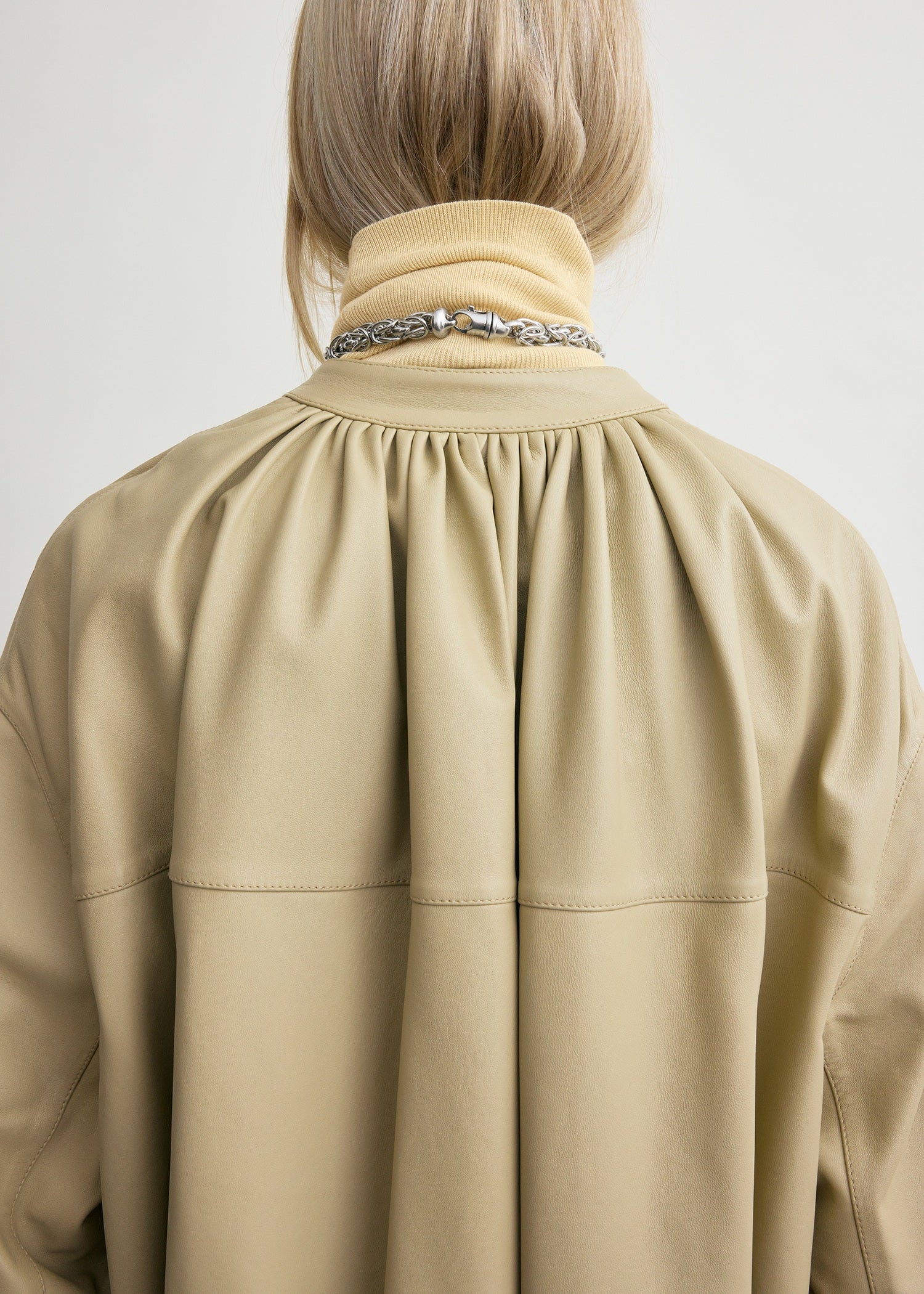 Collarless leather coat rye