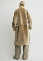 Collarless shearling coat rye