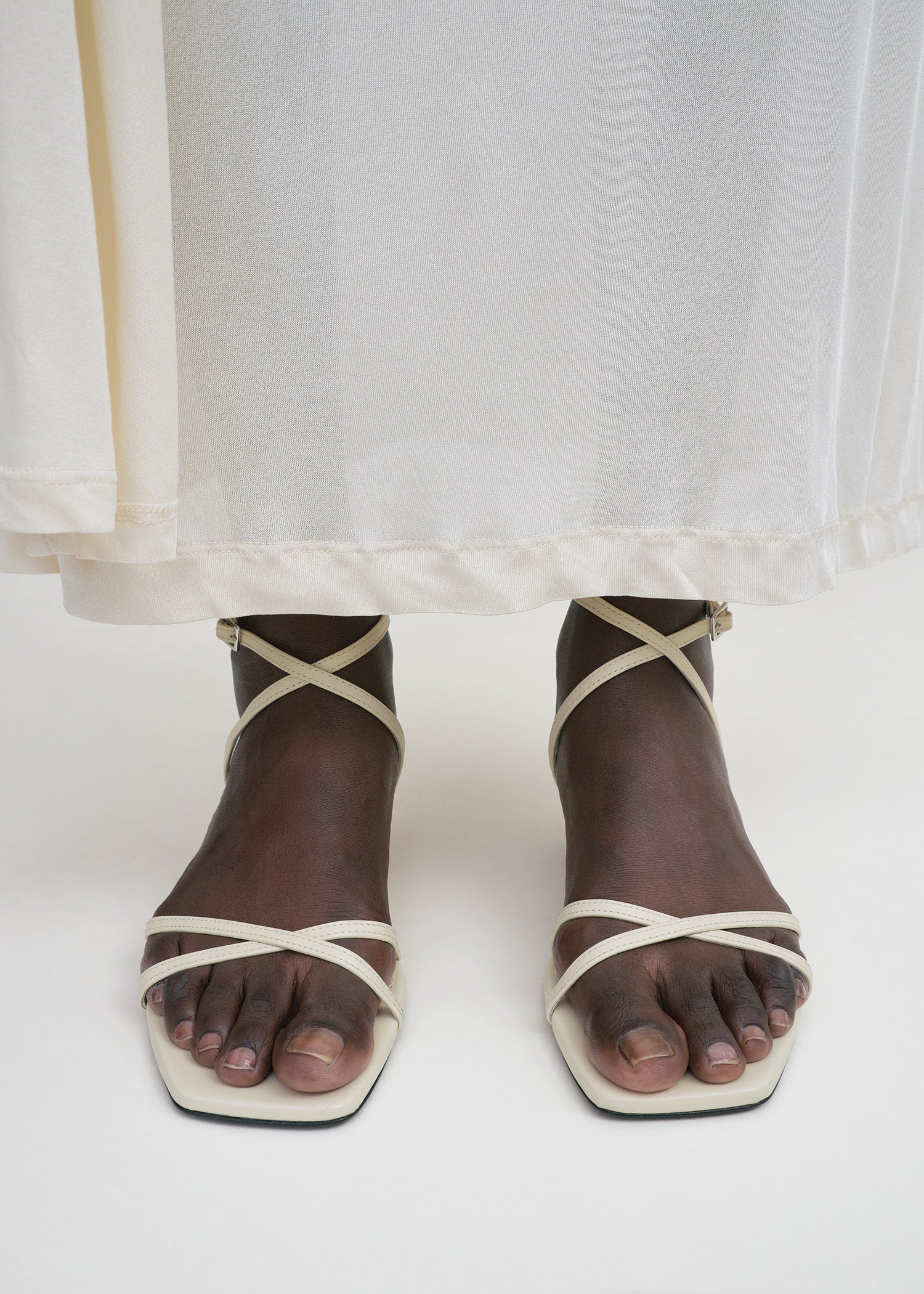 Leather crossover sandals off-white