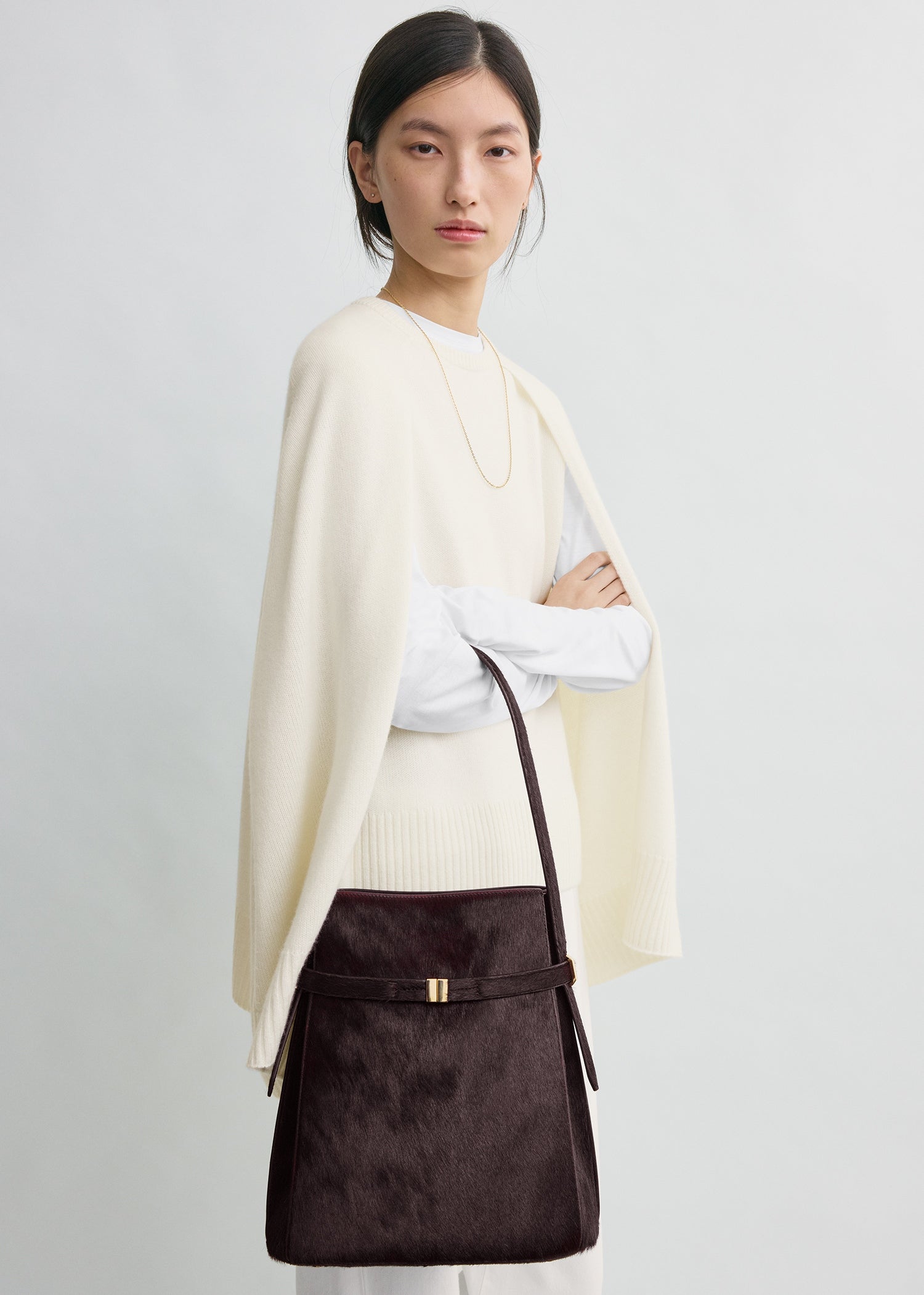 Belted pony hair bucket bag wine