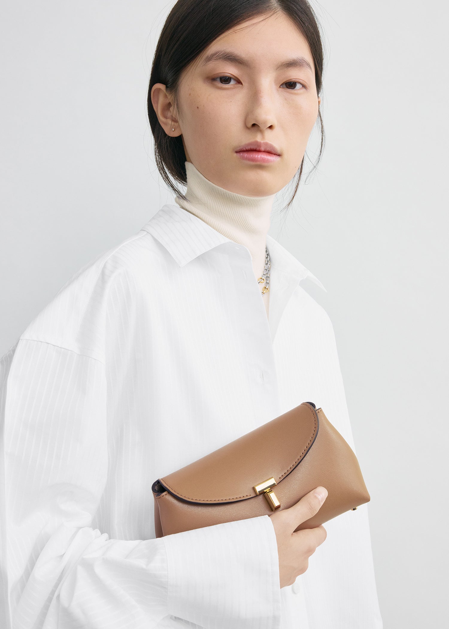 Mini T-lock leather clutch camel