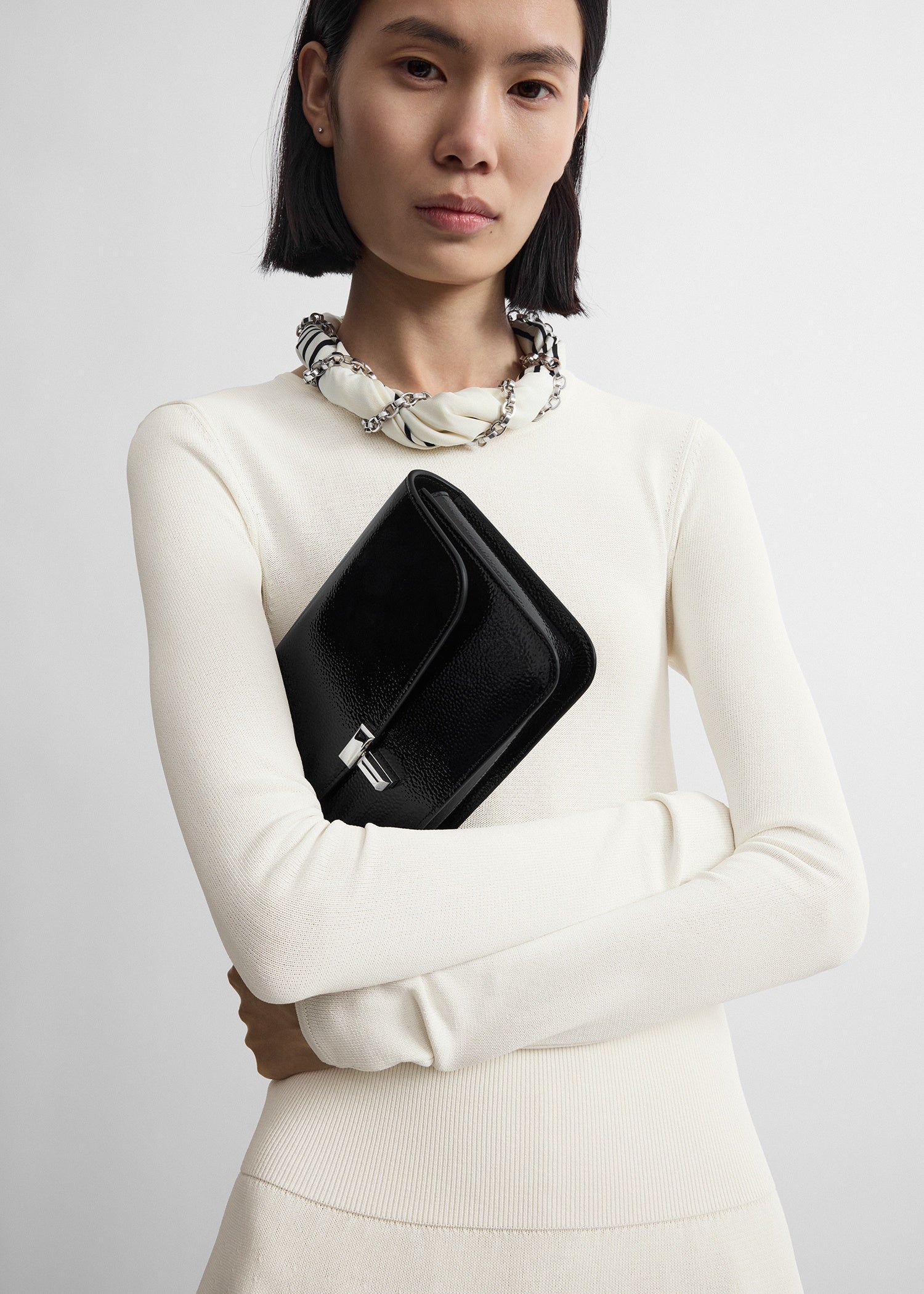 T-lock grained-patent crossbody black