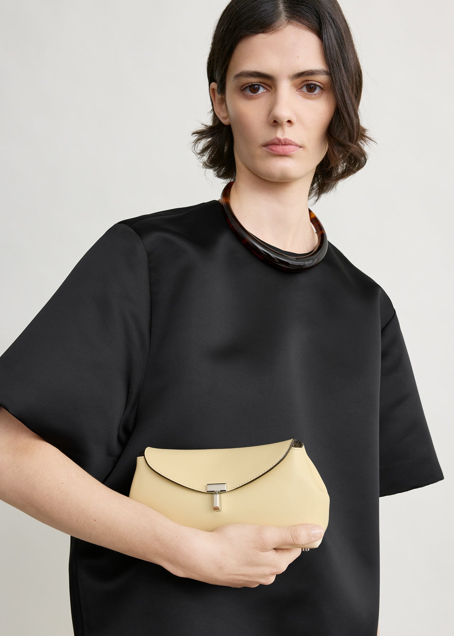 Mini T-lock leather clutch champagne