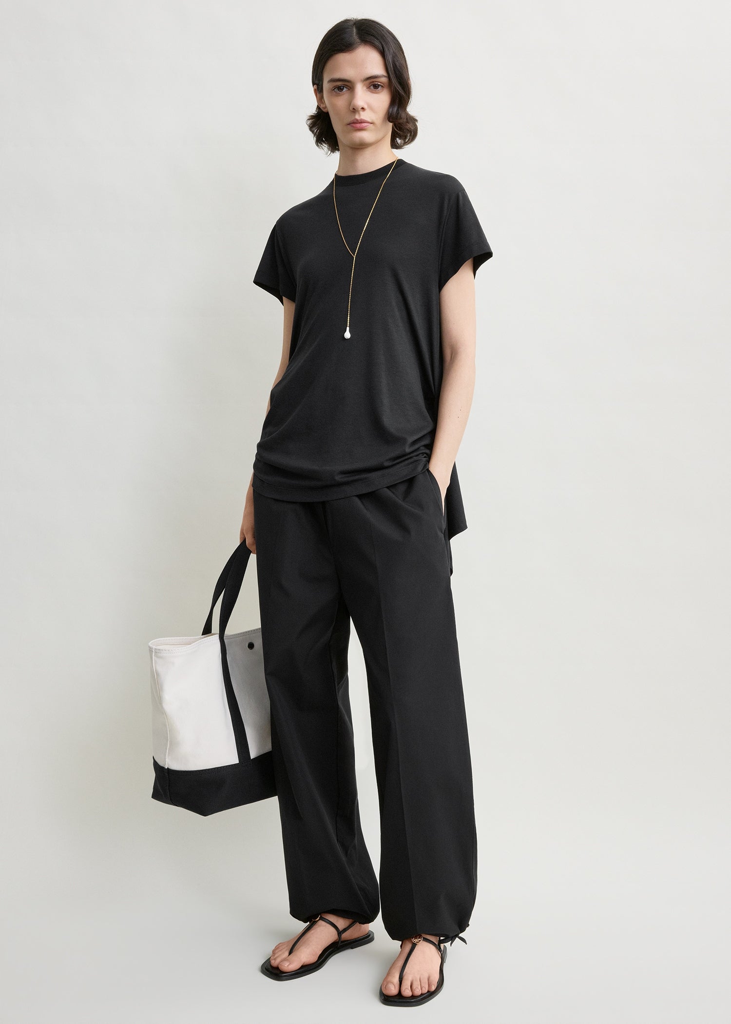 Drawstring cotton trousers black from Toteme - $460