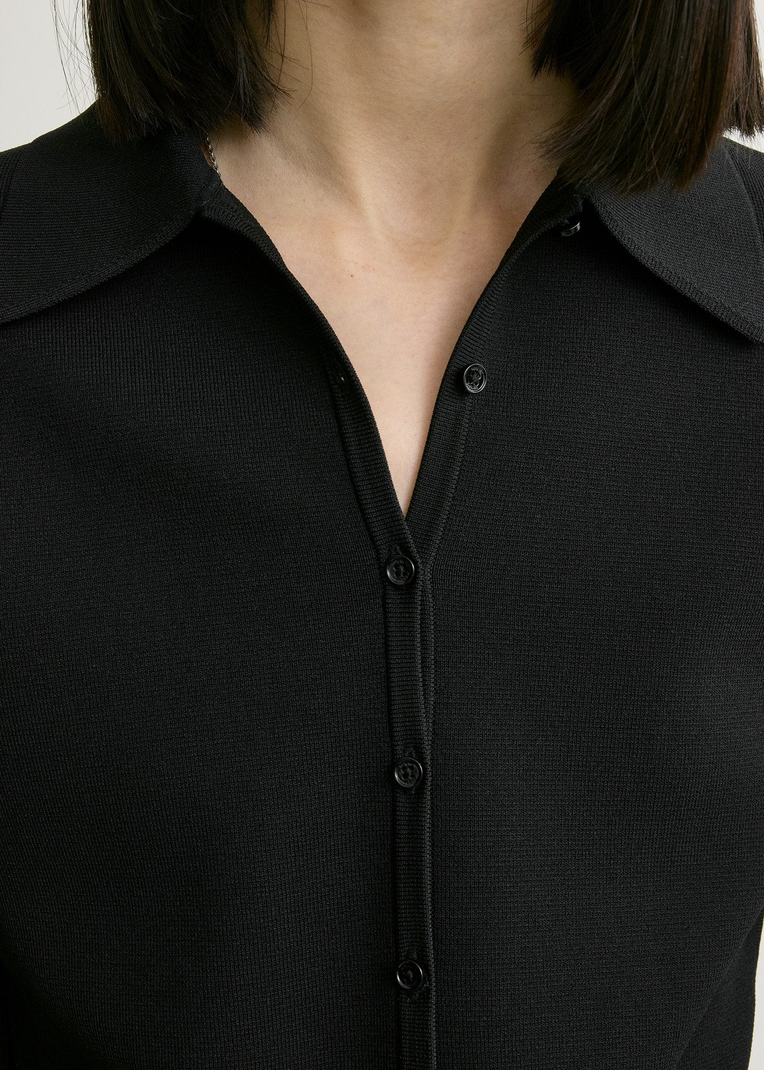 Compact knit buttoned top black