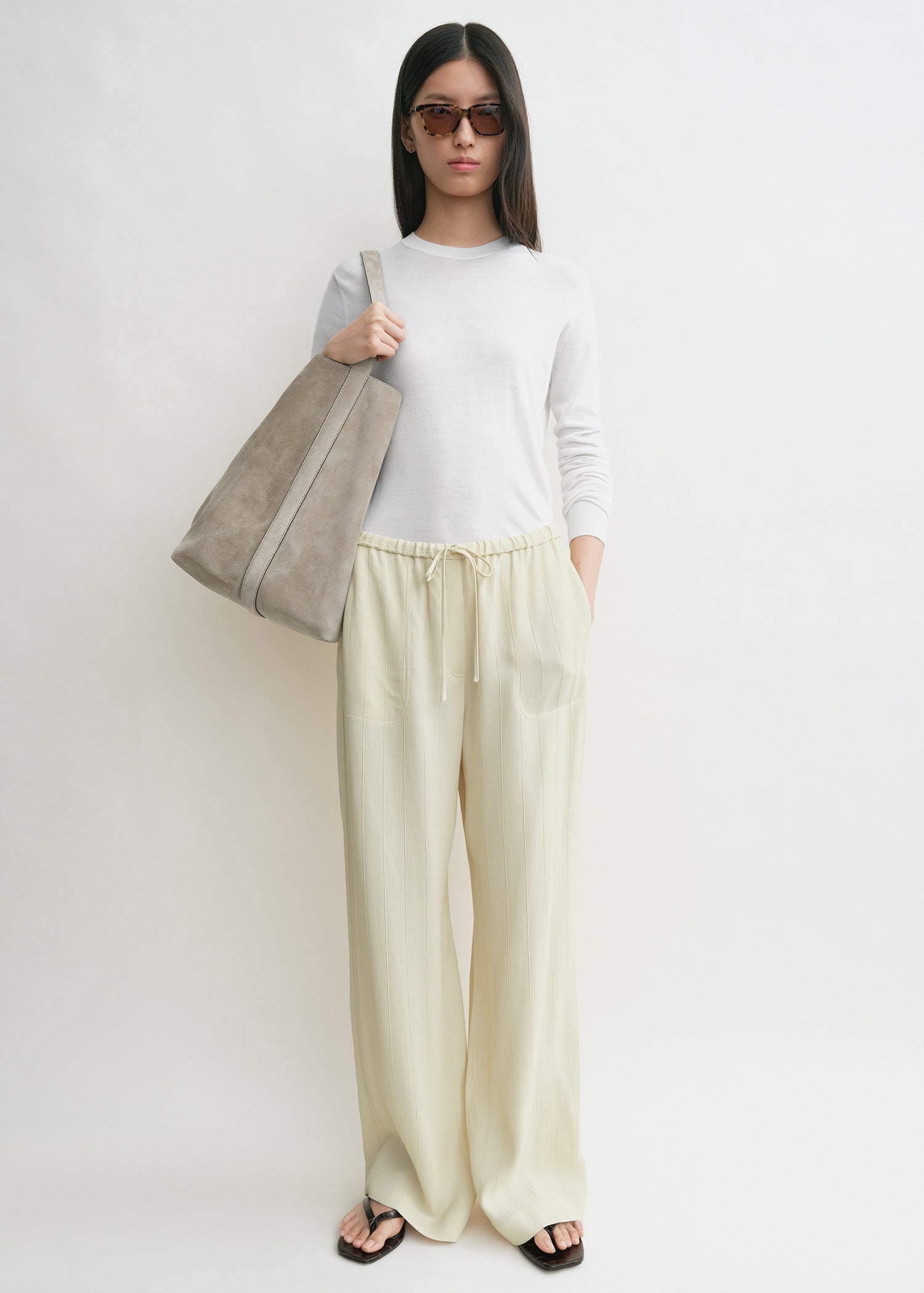Woven stripe drawstring trousers ecru from Toteme - $195