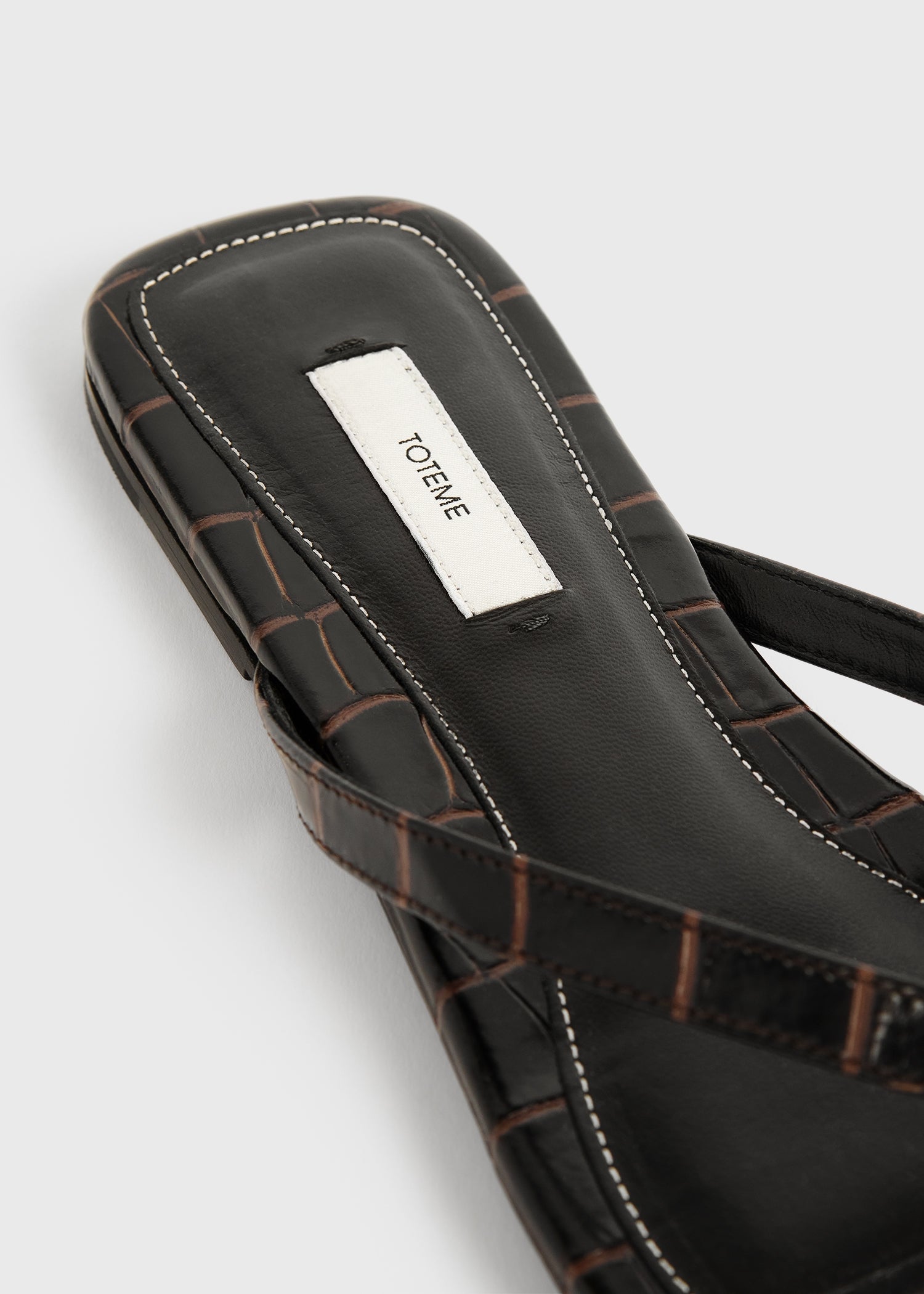 Croco-embossed flip flops dark brown