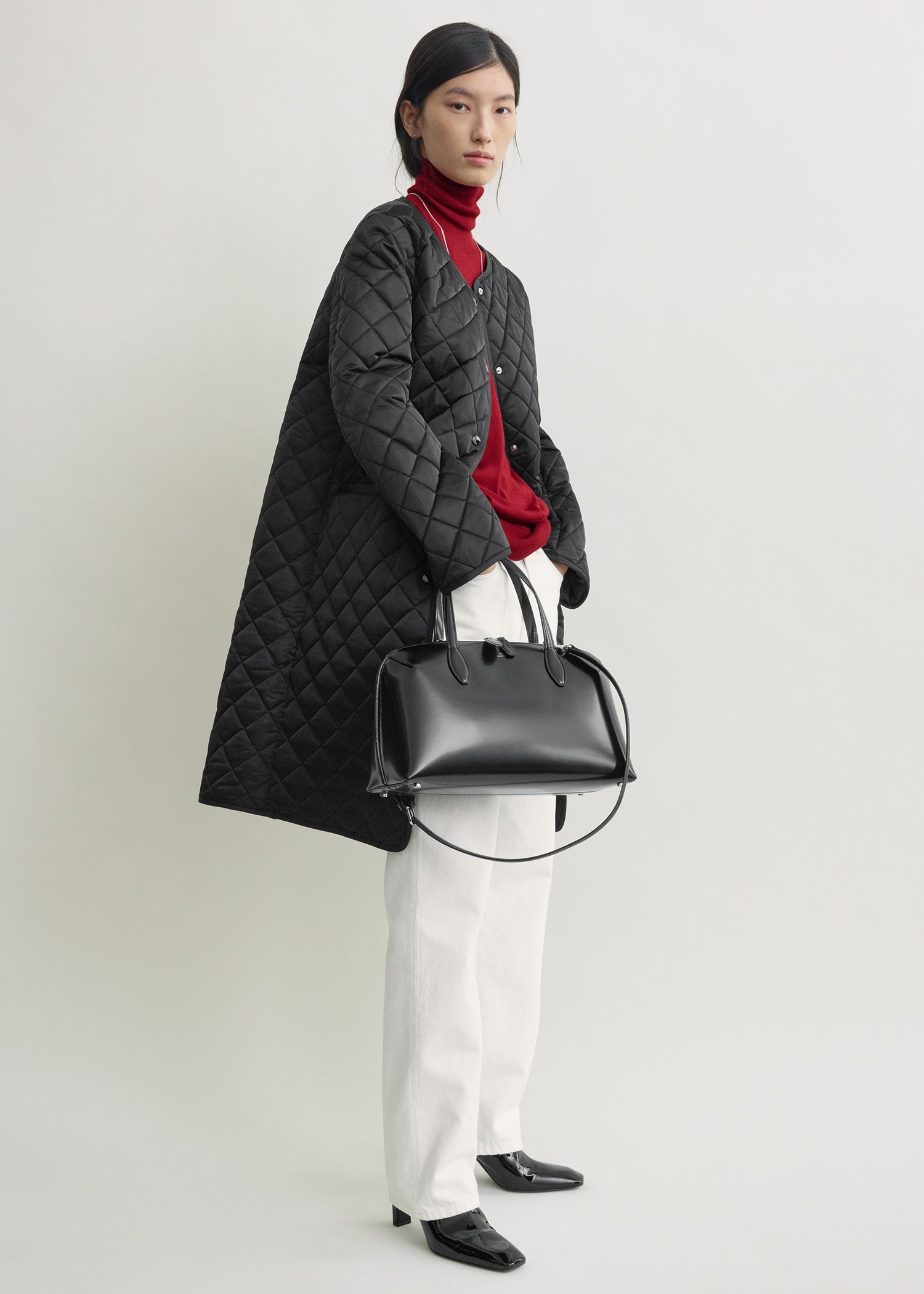 Quilted collarless coat black