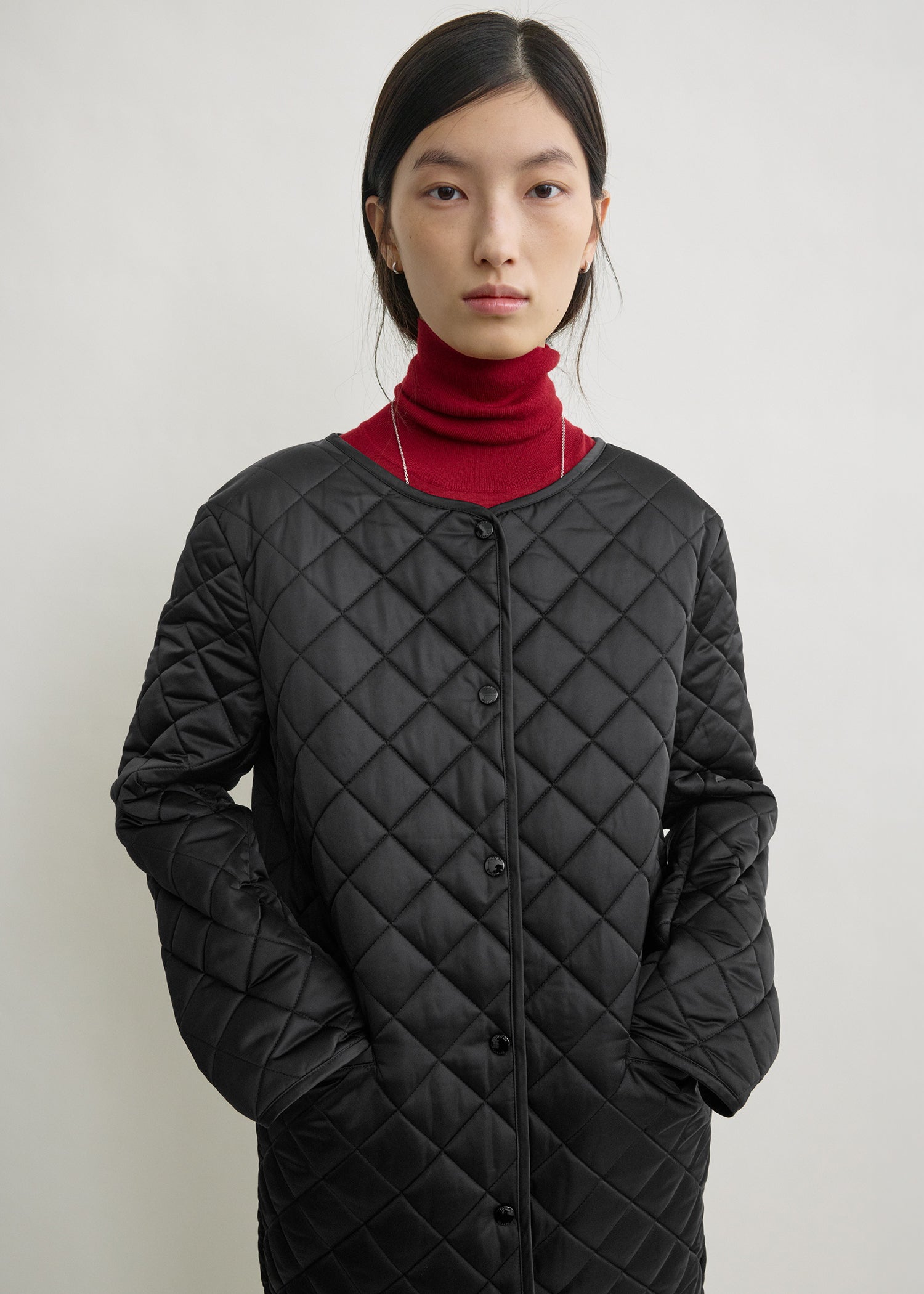 Quilted collarless coat black