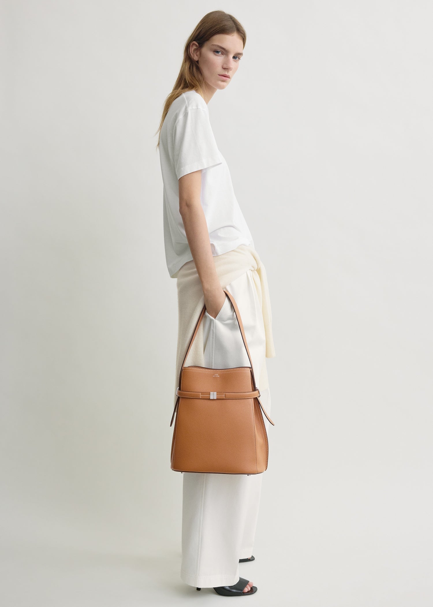 Belted grained-leather bucket bag tan