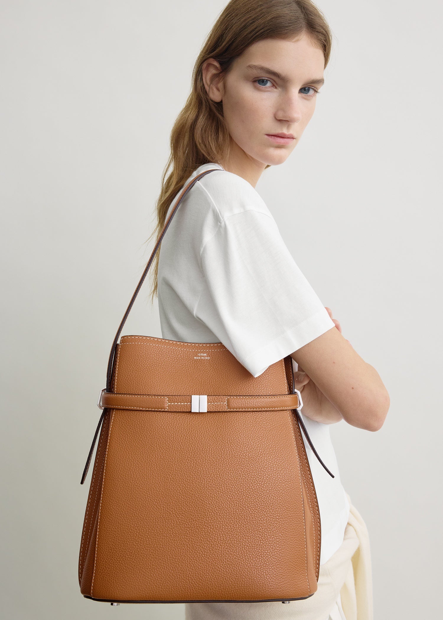 Belted grained-leather bucket bag tan