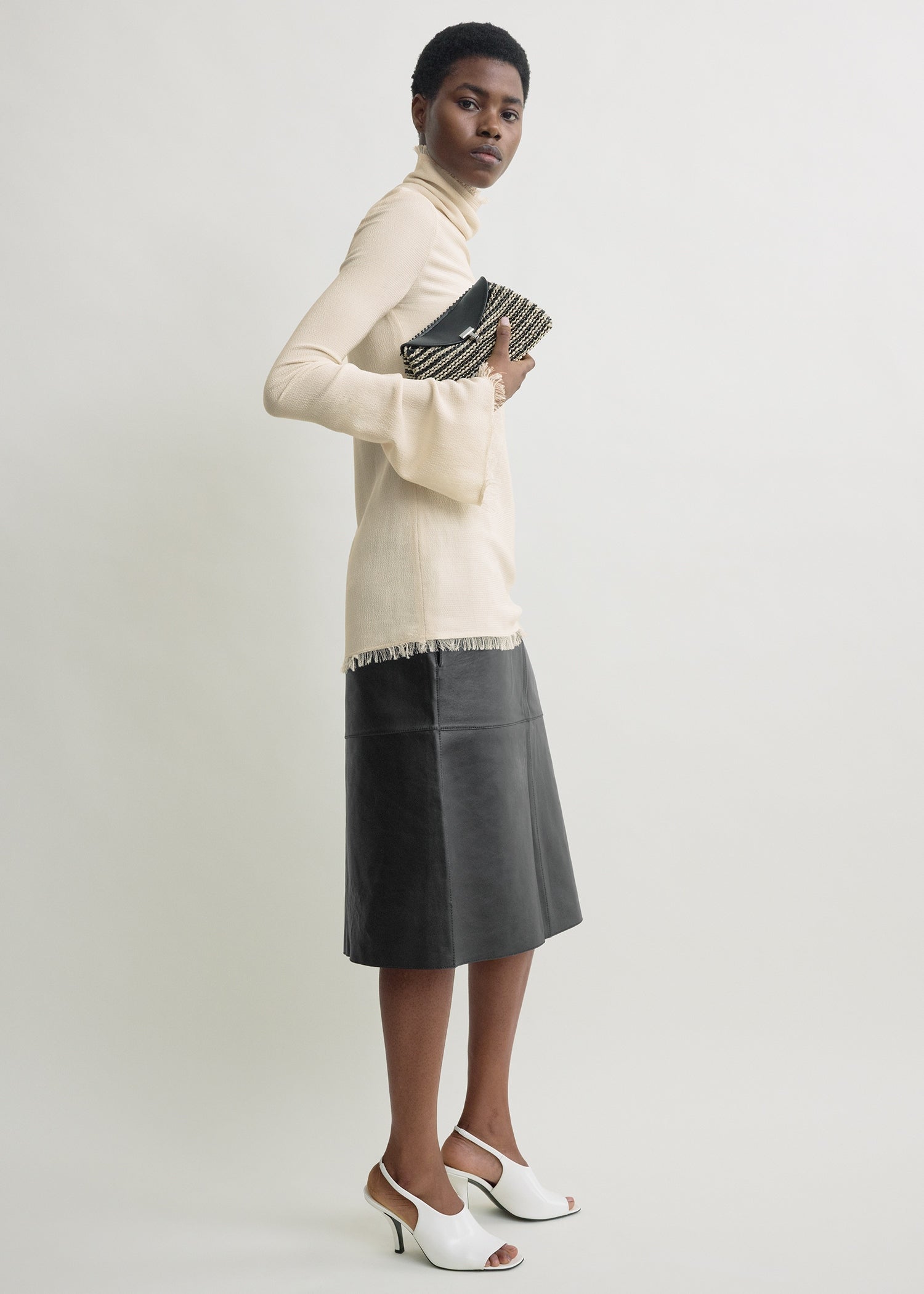Mini T-lock woven-leather clutch black/sand