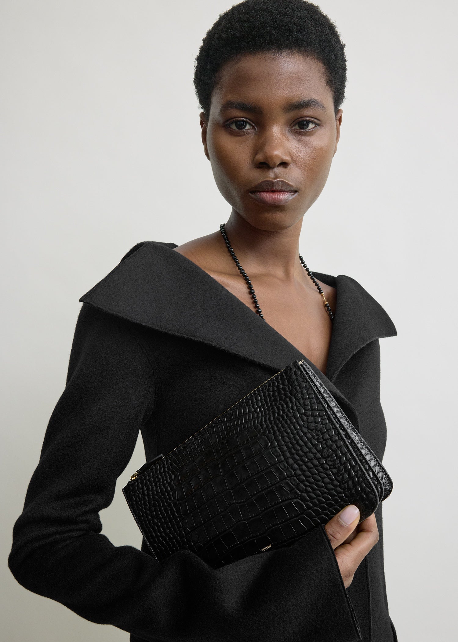 Threefold croco-embossed clutch black – TOTEME