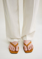 Croco-embossed flip flops tangerine