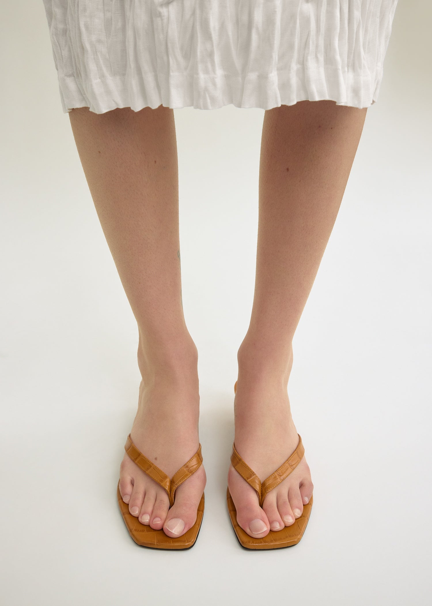 Croco-embossed heeled flip flops tangerine