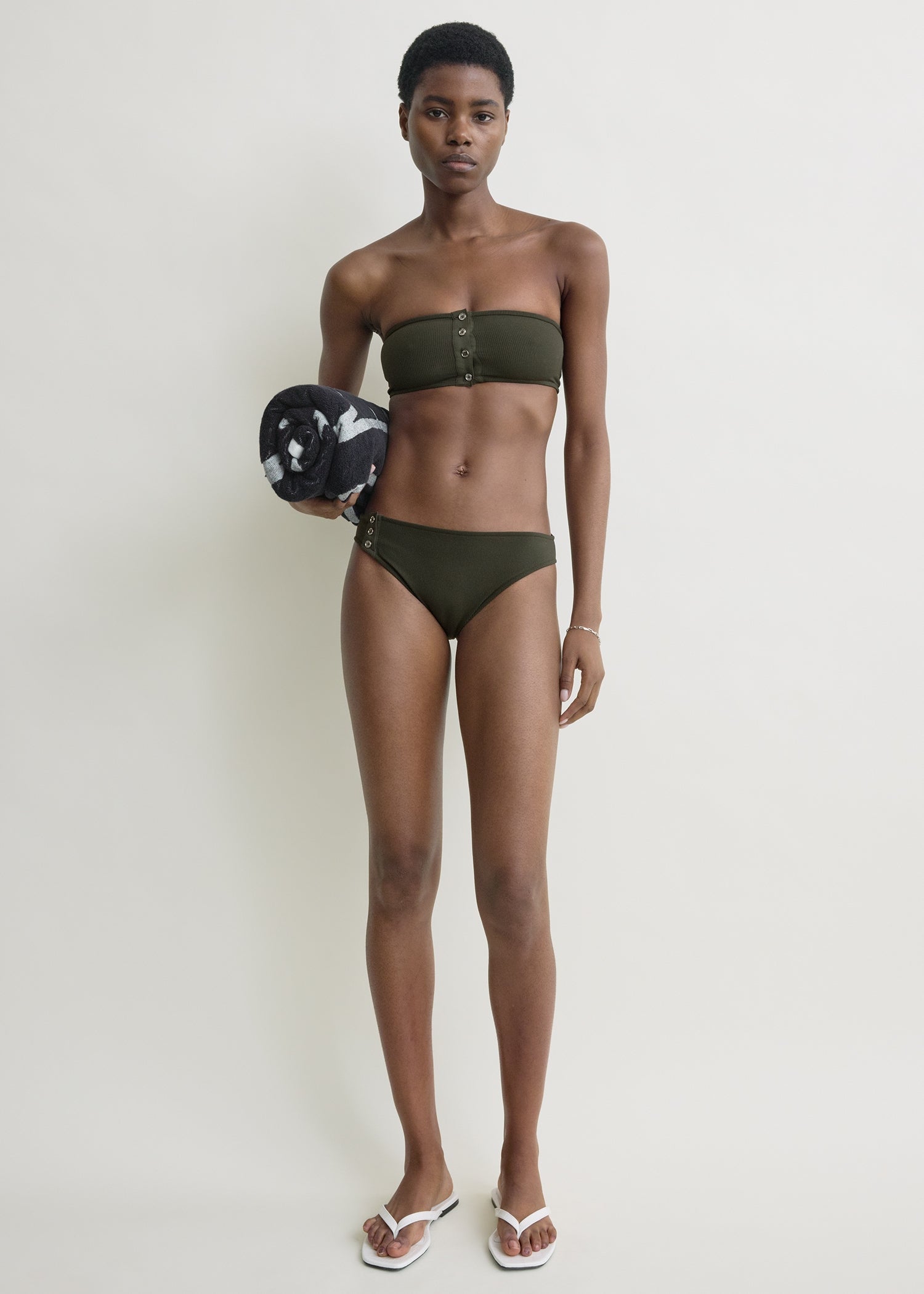 Ribbed strapless bikini top dark green from Toteme - $220