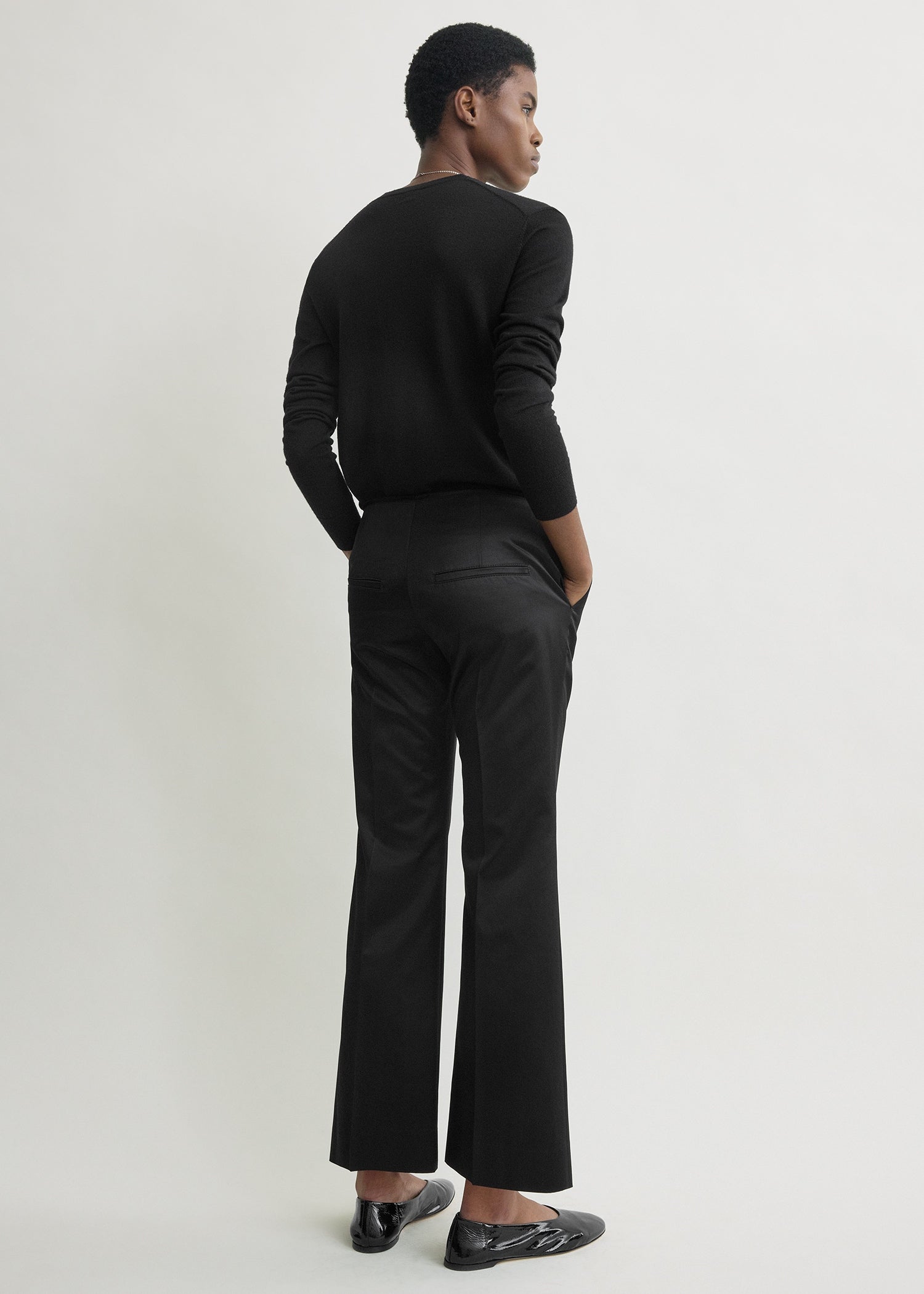 Kick flare raw-edge trousers black