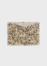 Stracciatella shearling muff black/white