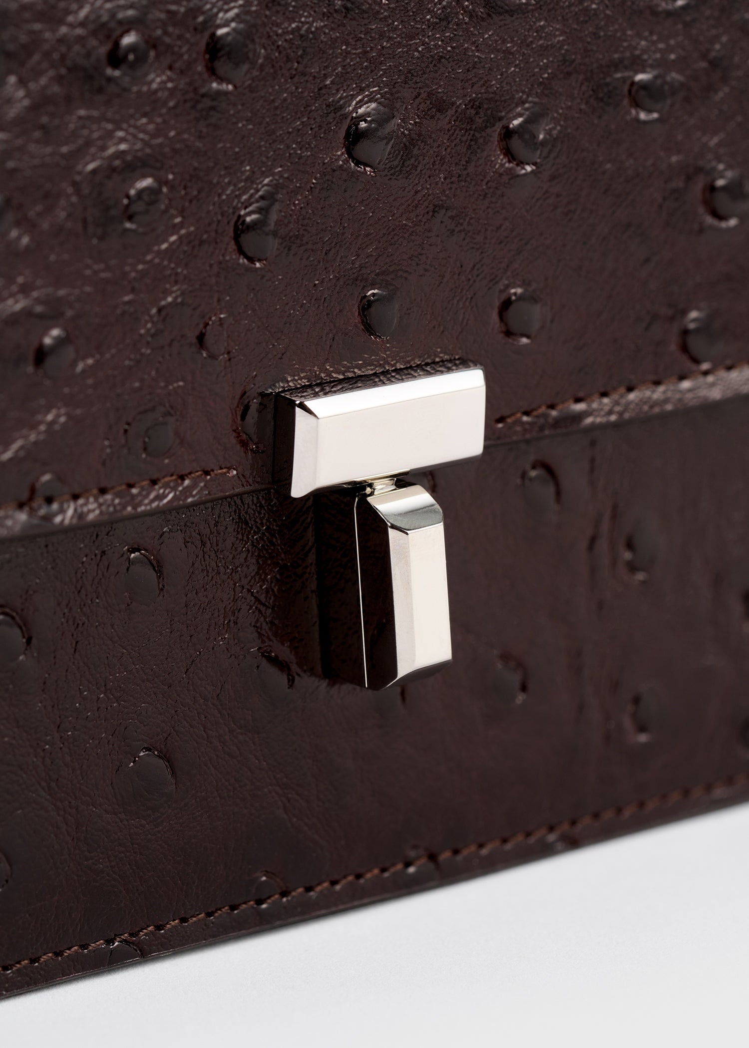 T-lock ostrich-embossed crossbody bordeaux