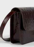 T-lock ostrich-embossed crossbody bordeaux