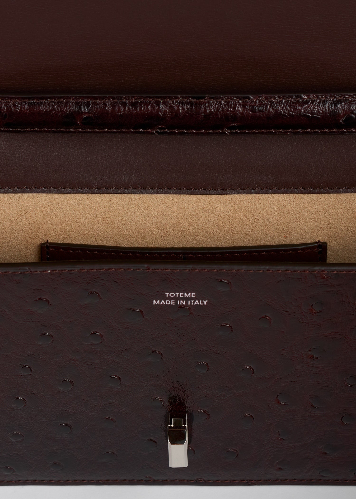 T-lock ostrich-embossed crossbody bordeaux