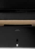 T-lock grained-patent crossbody black