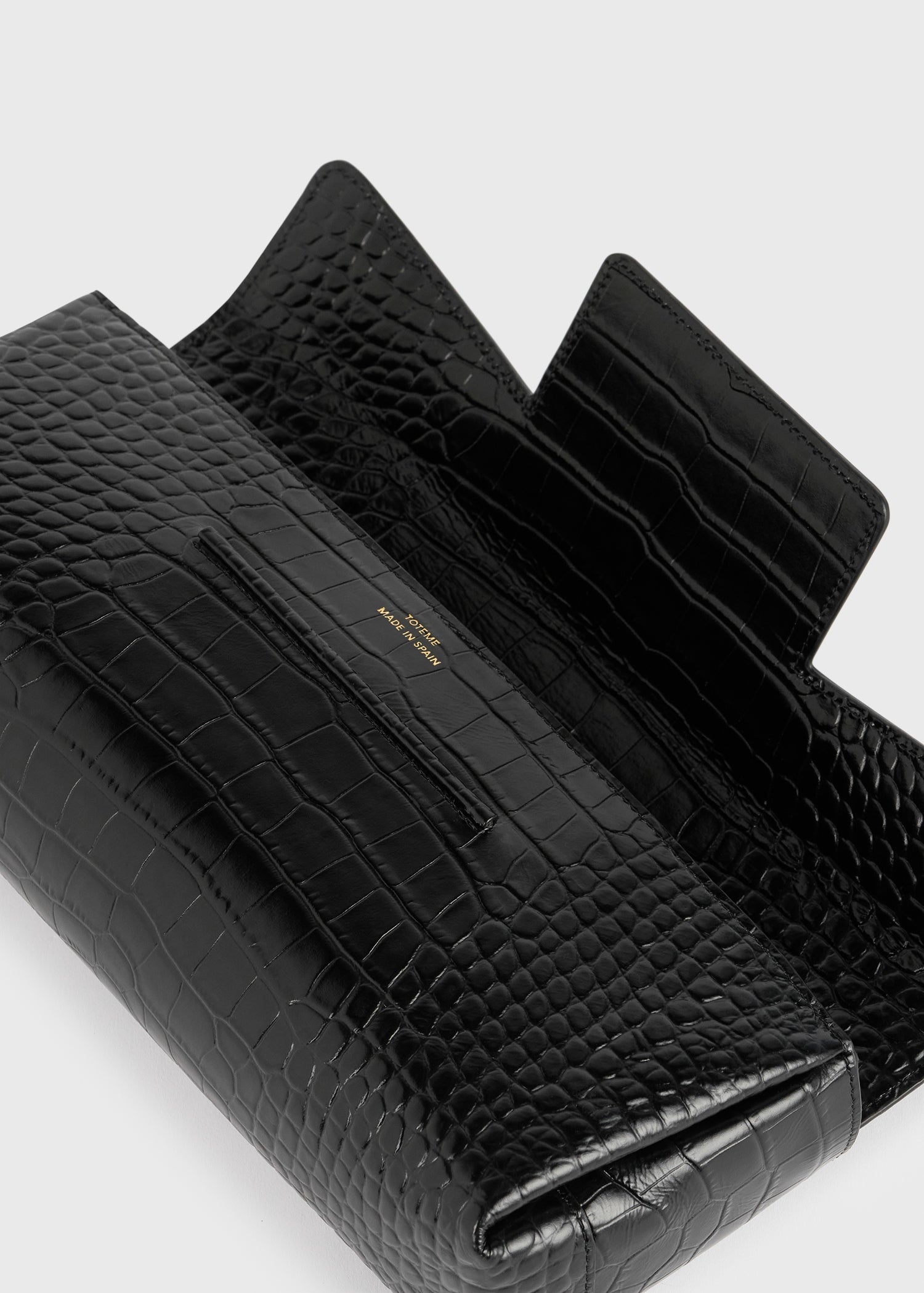 Soft croco-embossed t-clutch black – TOTEME