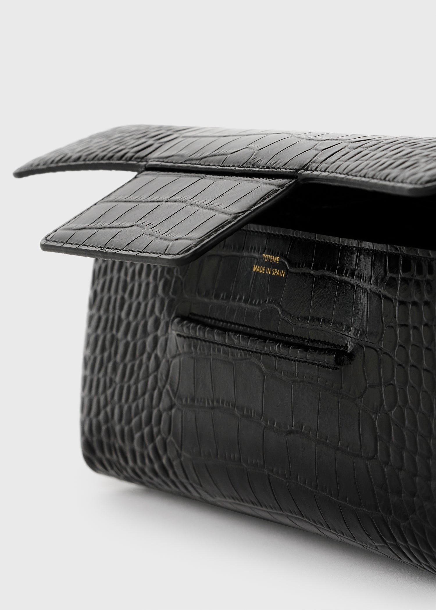 Soft croco-embossed t-clutch black – TOTEME