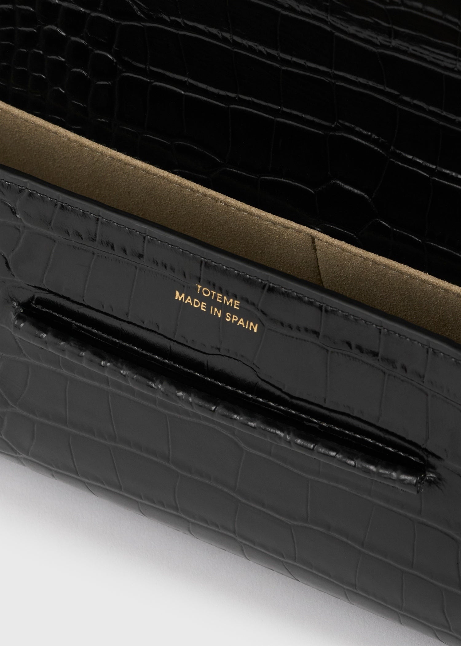 Soft croco-embossed t-clutch black