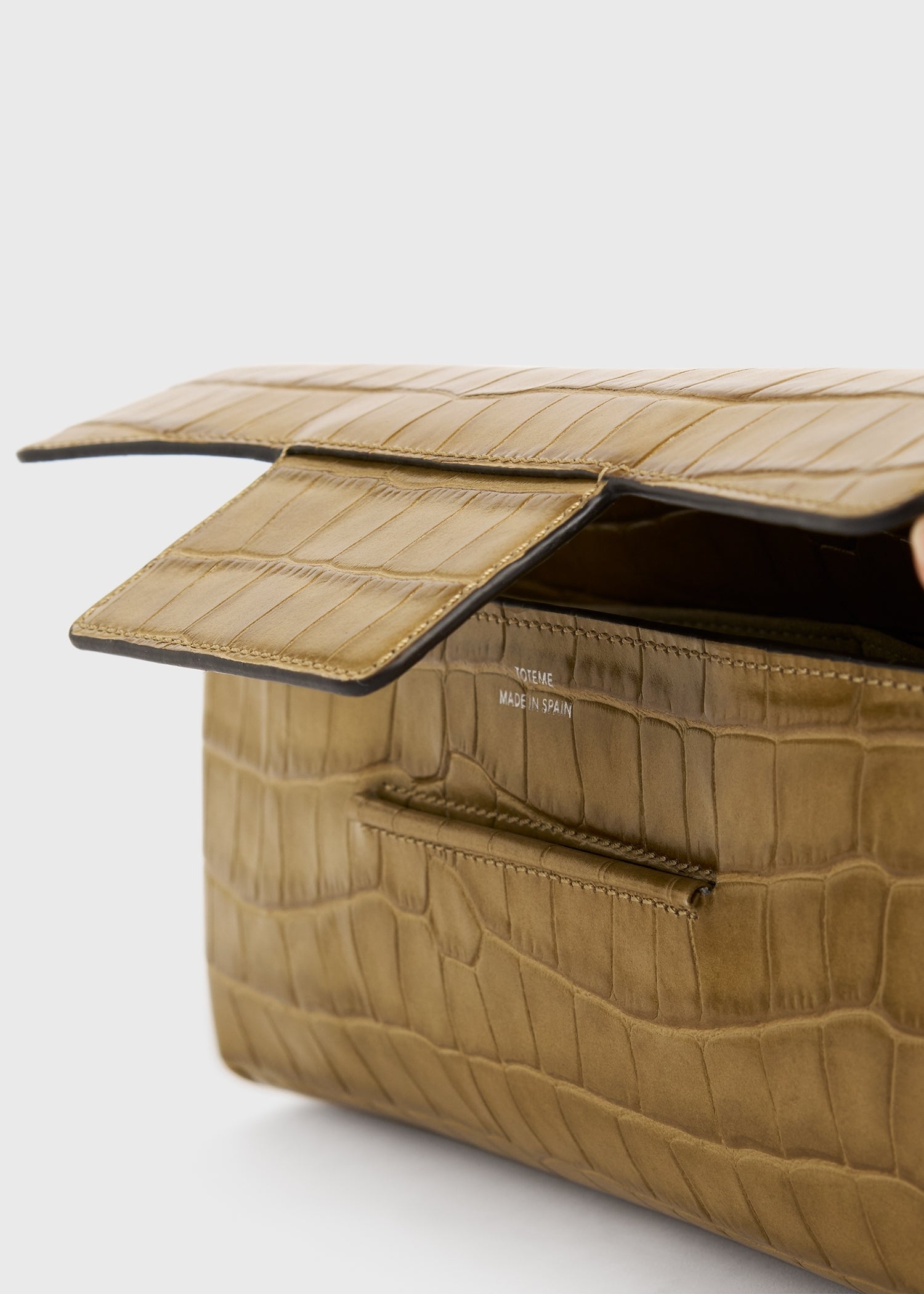 Soft croco-embossed t-clutch biscuit