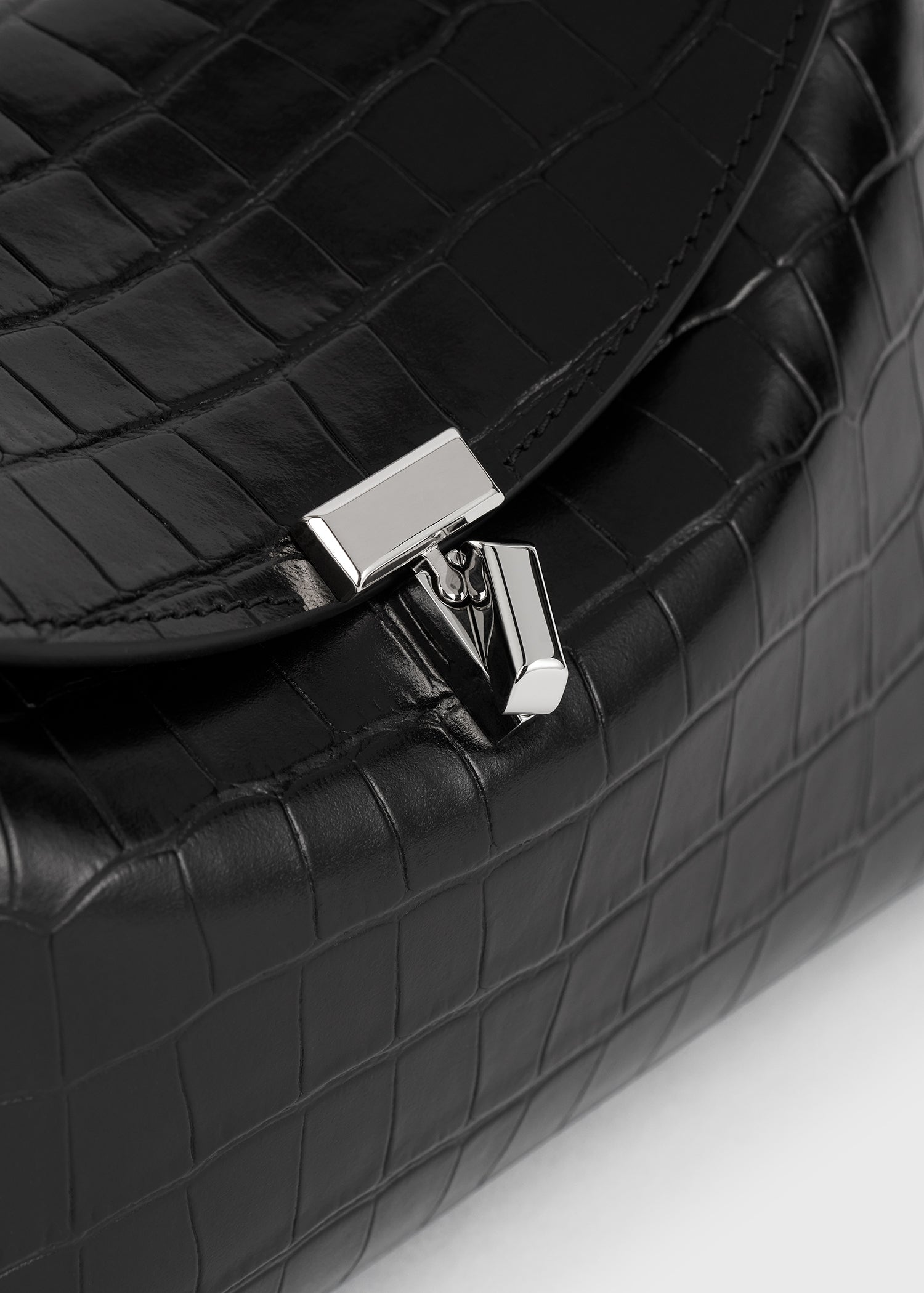 T-lock croco-embossed clutch black