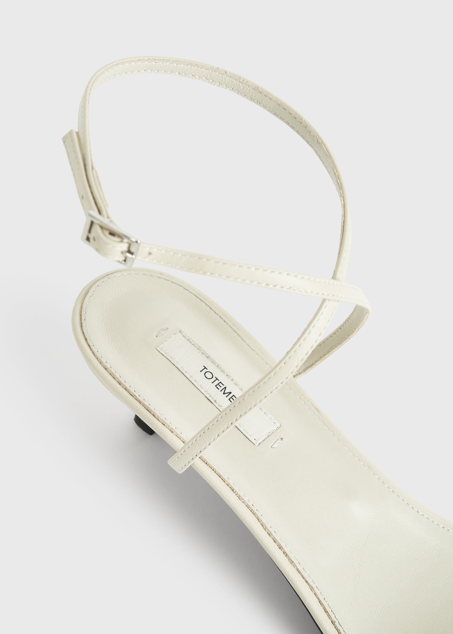 Leather crossover sandals off-white