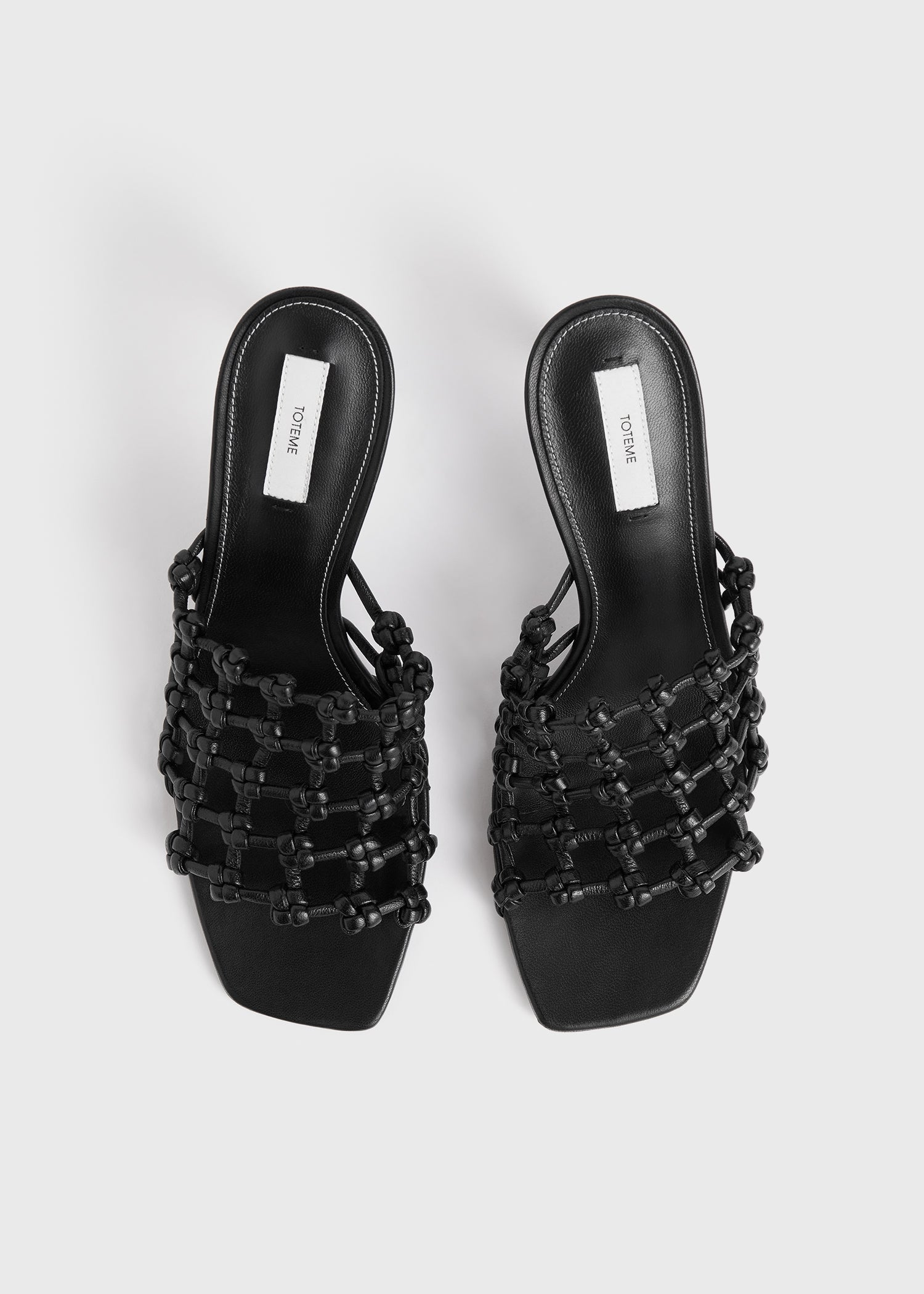 Braided-leather bandeau mules black