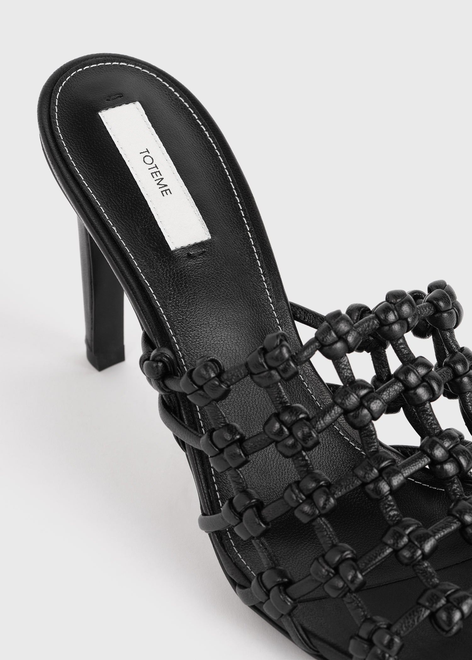 Braided-leather bandeau mules black