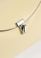 T-lock leather clutch champagne