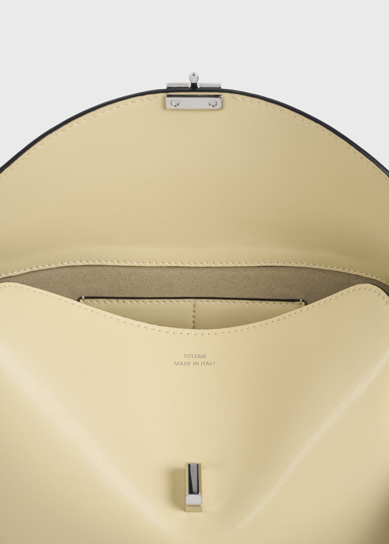 T-lock leather clutch champagne