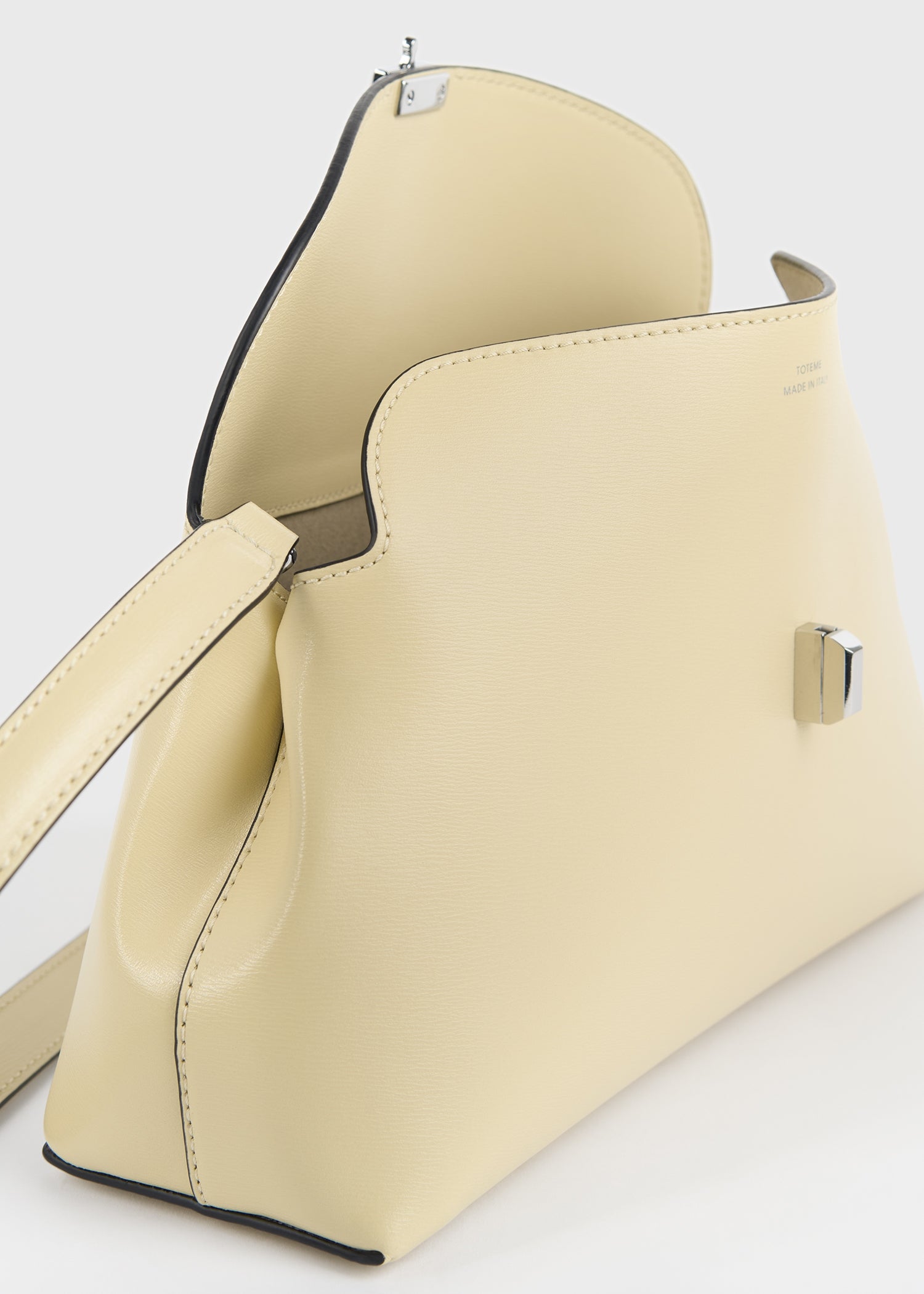 T-lock leather clutch champagne