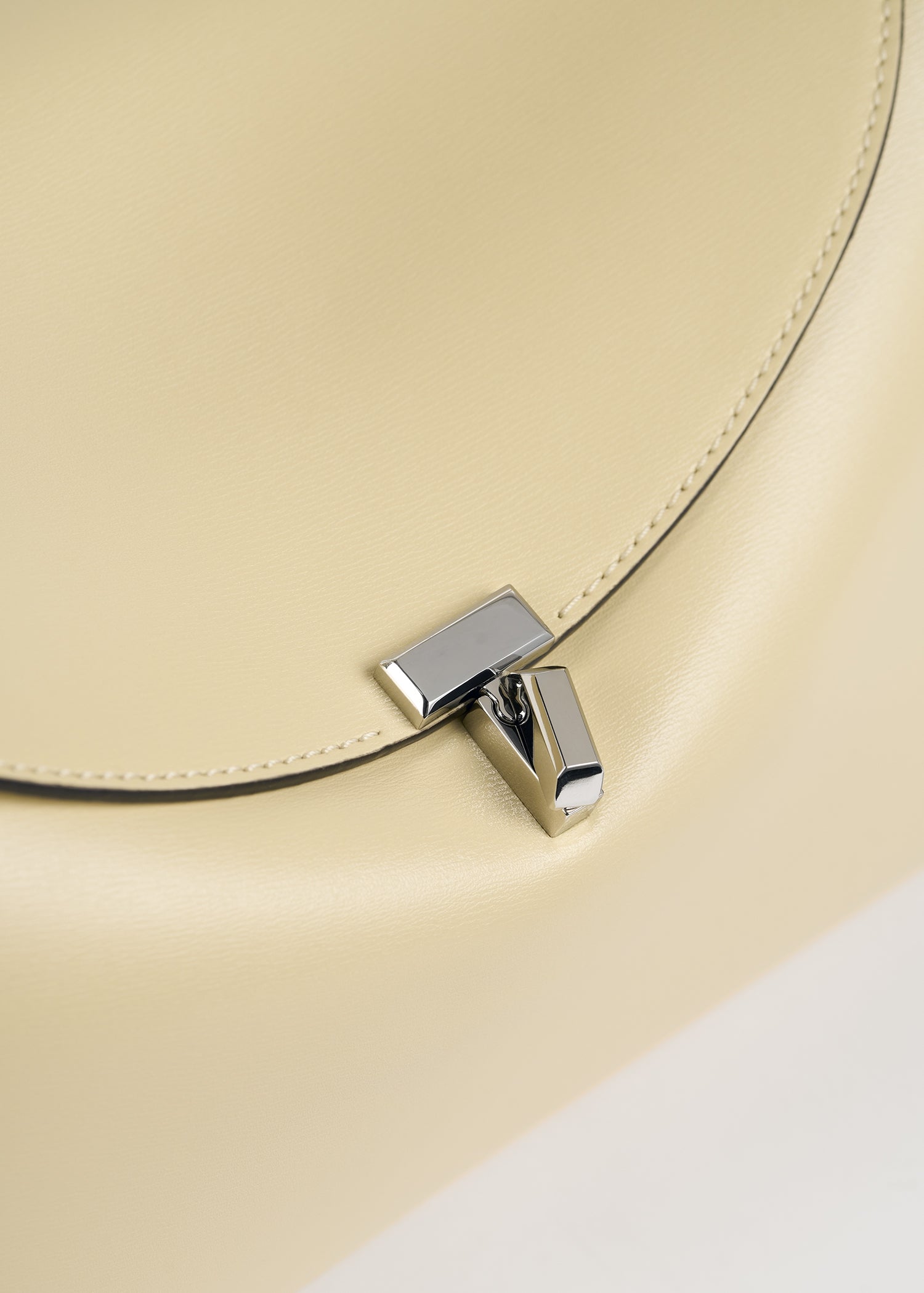 T-lock leather top handle champagne
