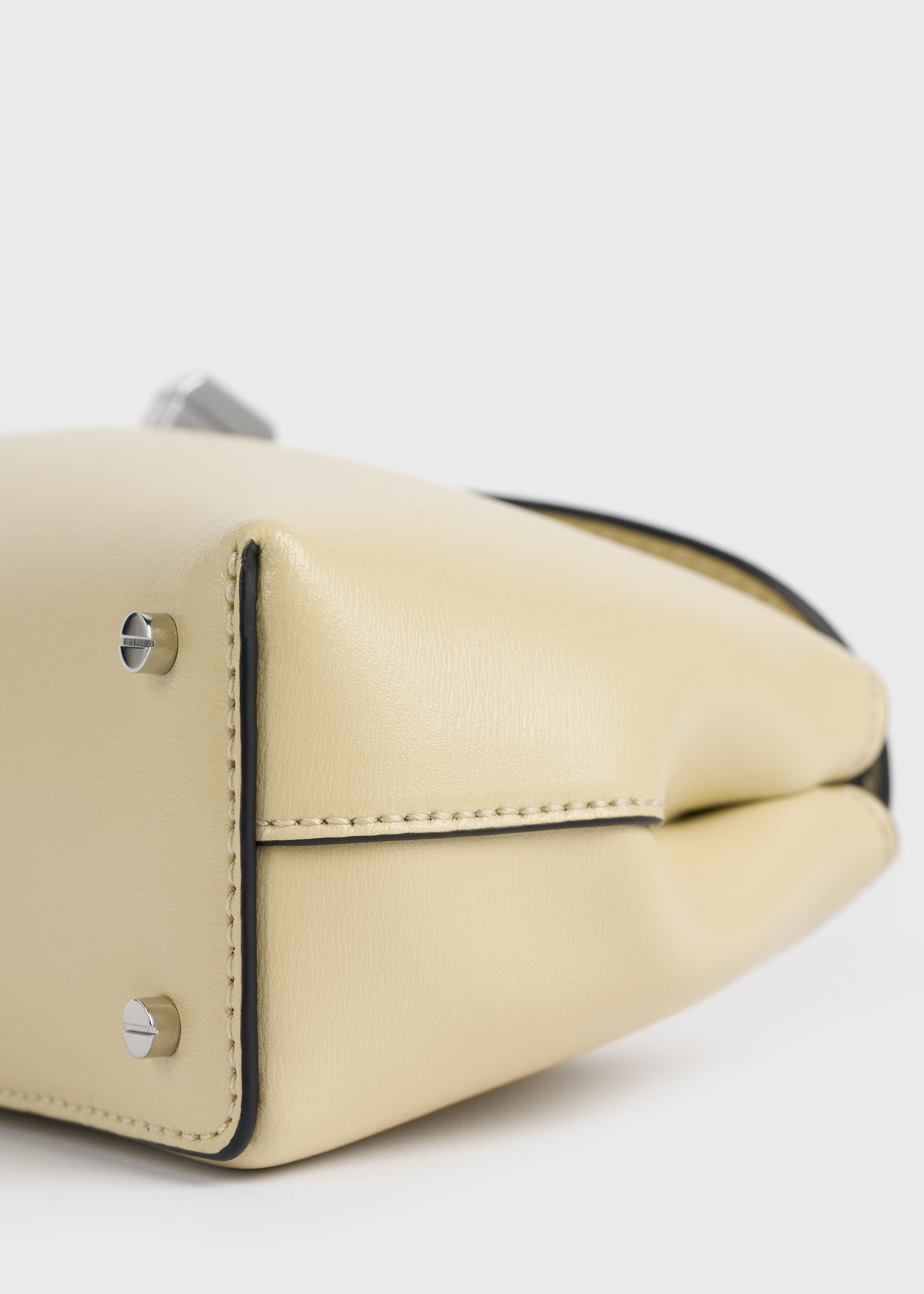 Mini T-lock leather clutch champagne