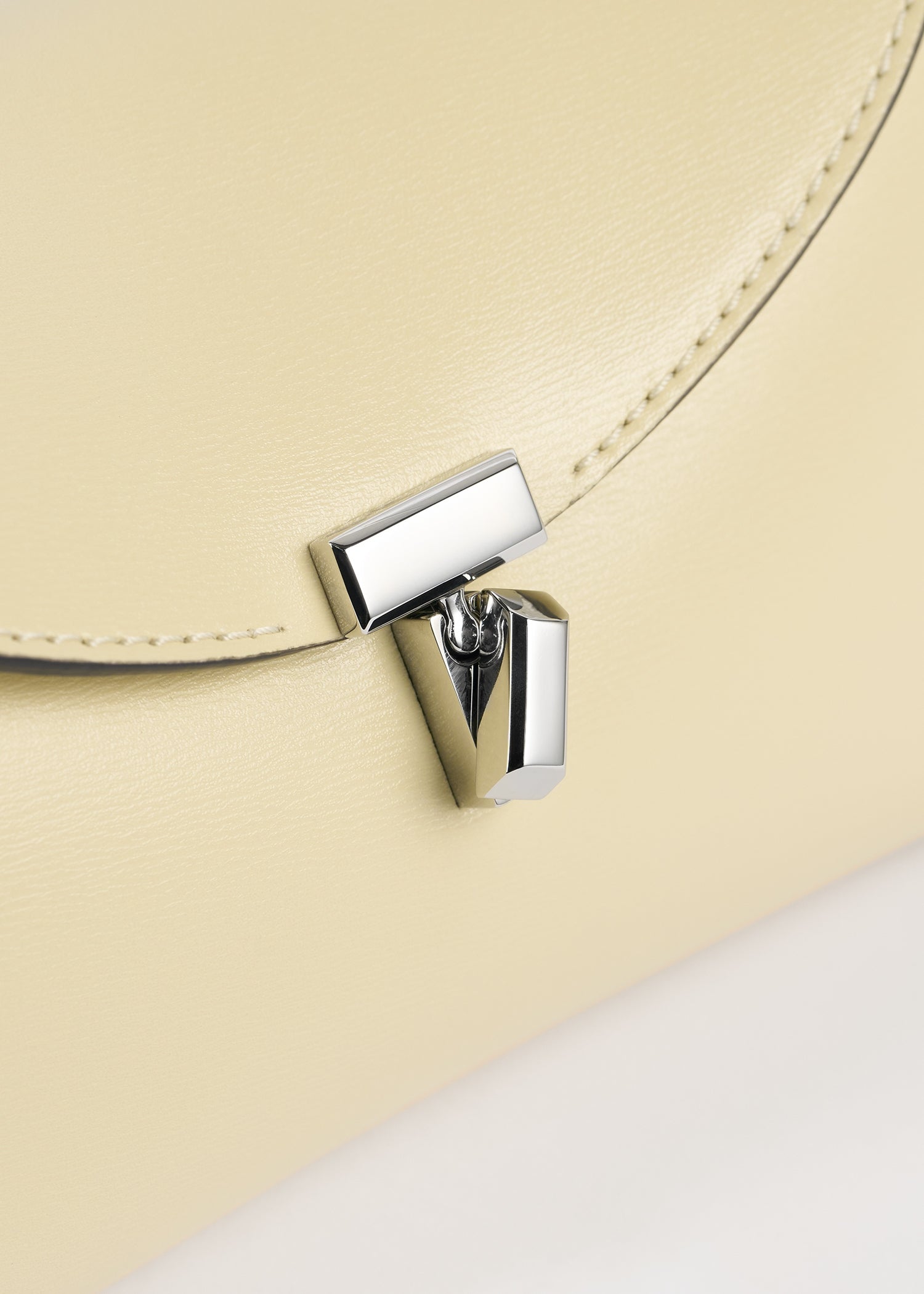Mini T-lock leather clutch champagne