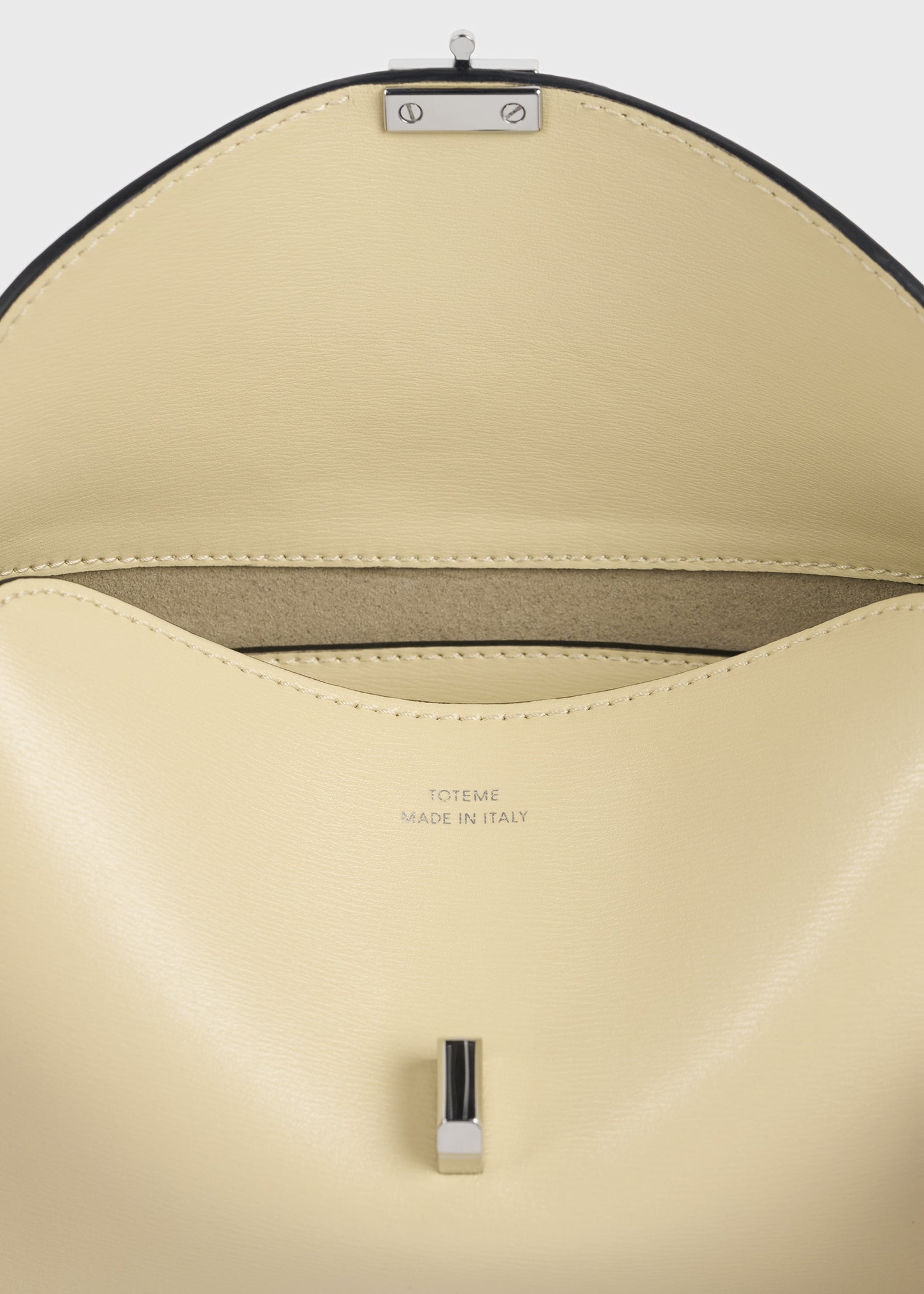 Mini T-lock leather clutch champagne