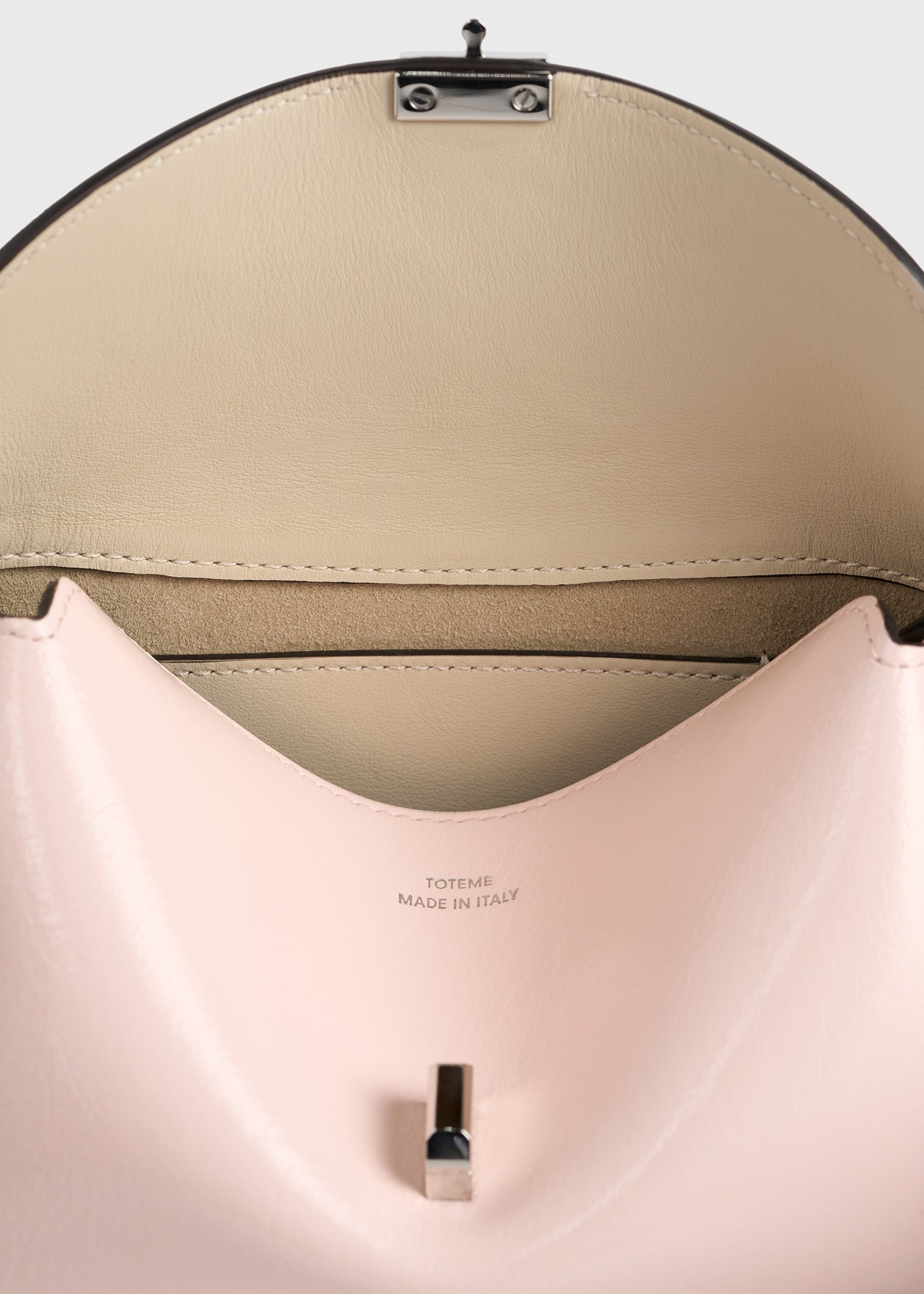 Mini T-lock naplack clutch flamingo – TOTEME