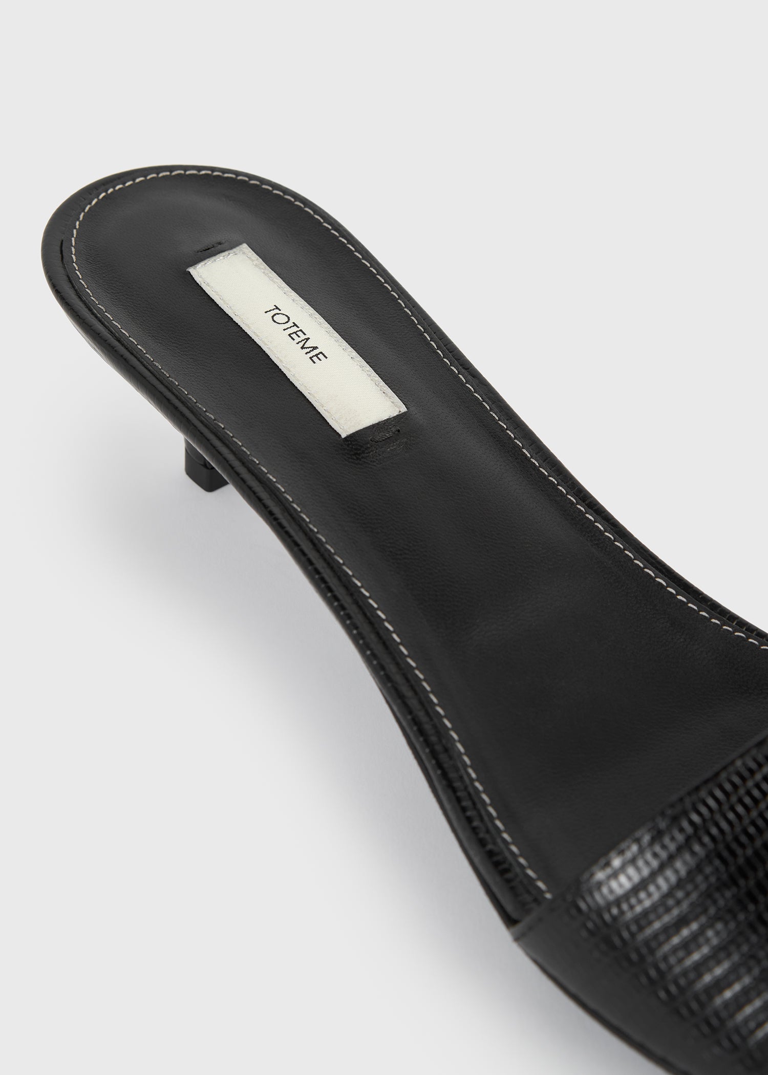 Slim lizard-embossed bandeau mules black
