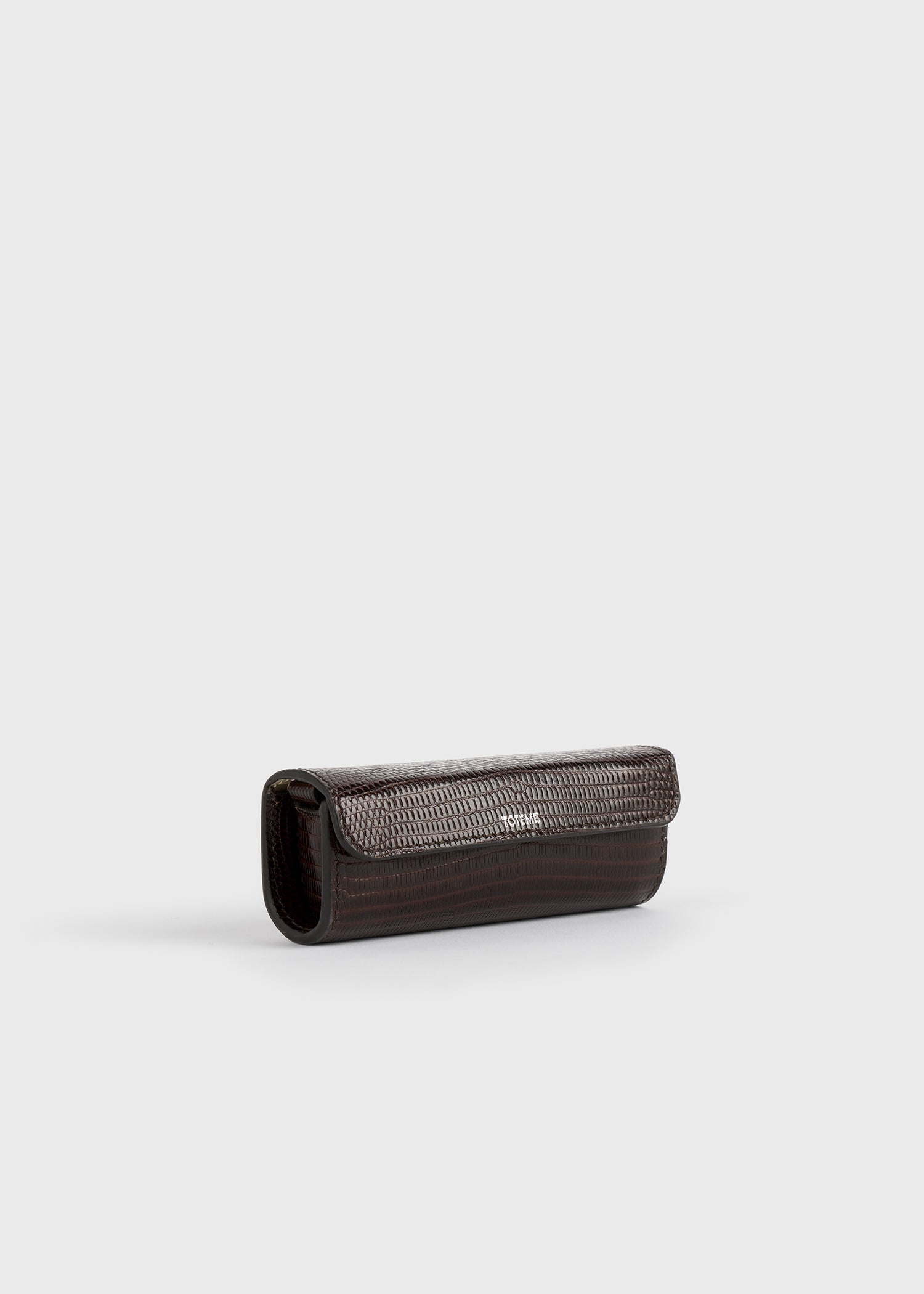 Lizard-embossed lipstick case brown