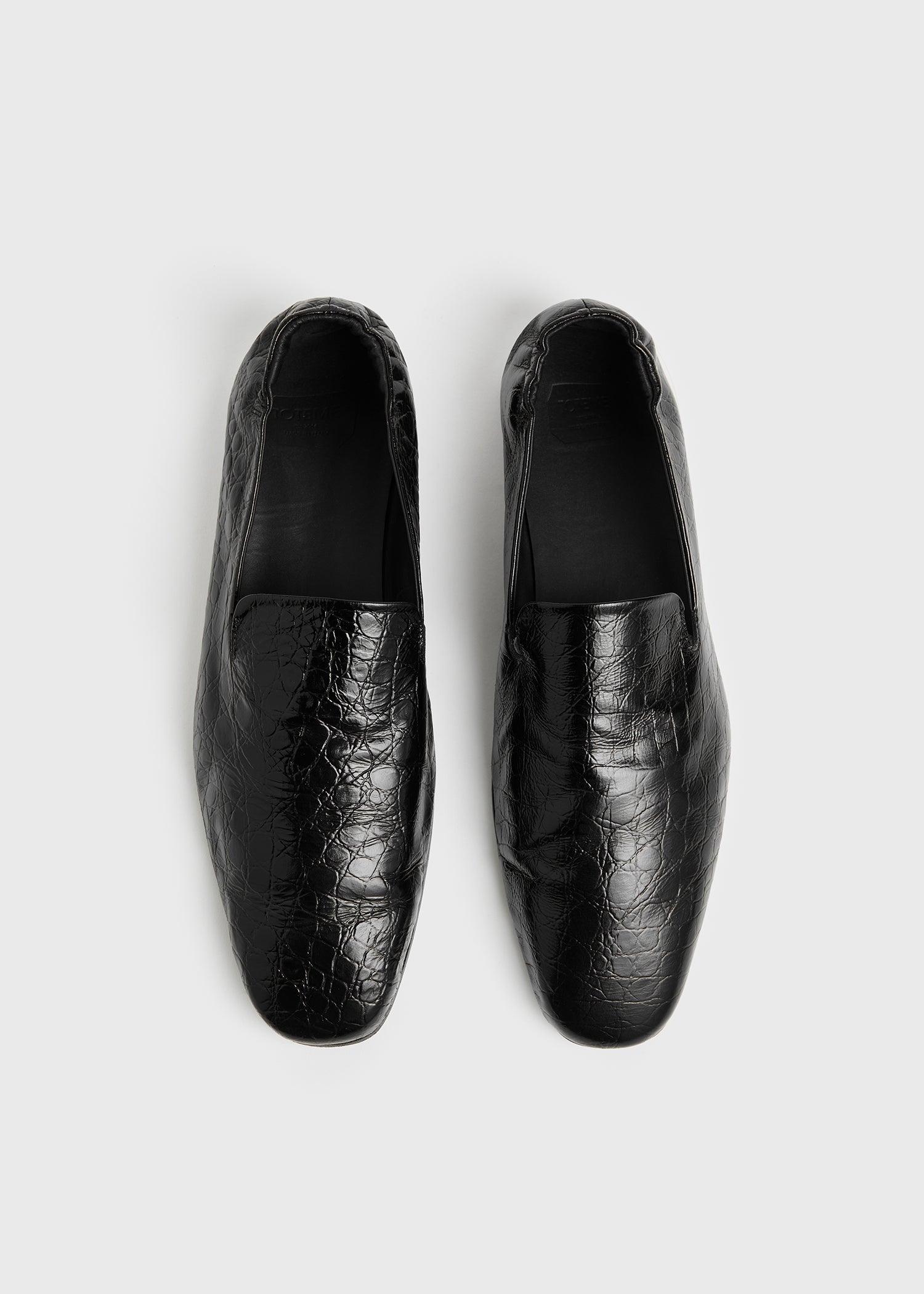 Soft croco-embossed loafers black