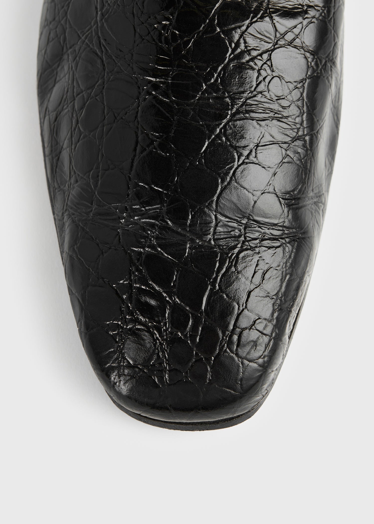 Soft croco-embossed loafers black