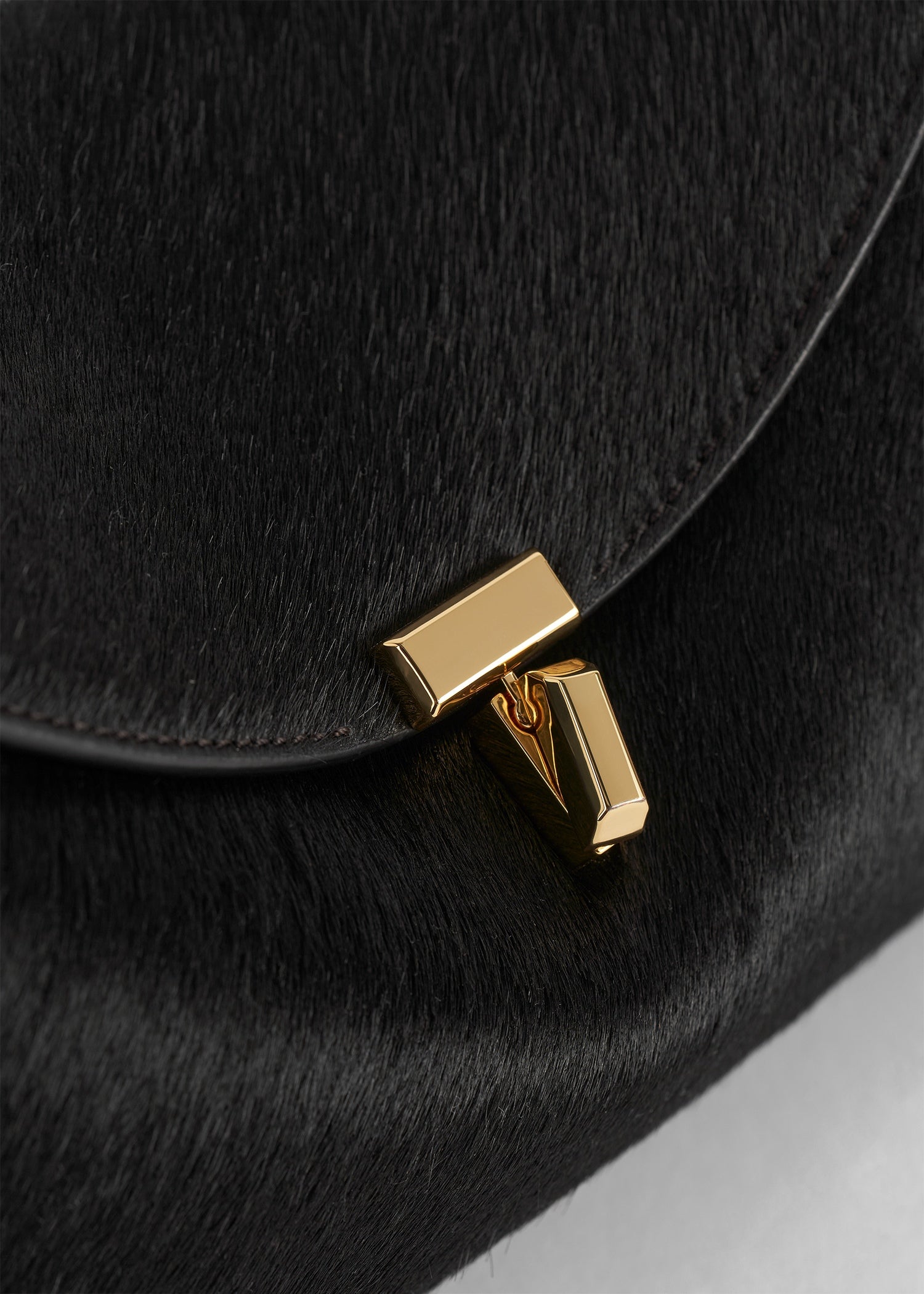 T-lock pony hair clutch black
